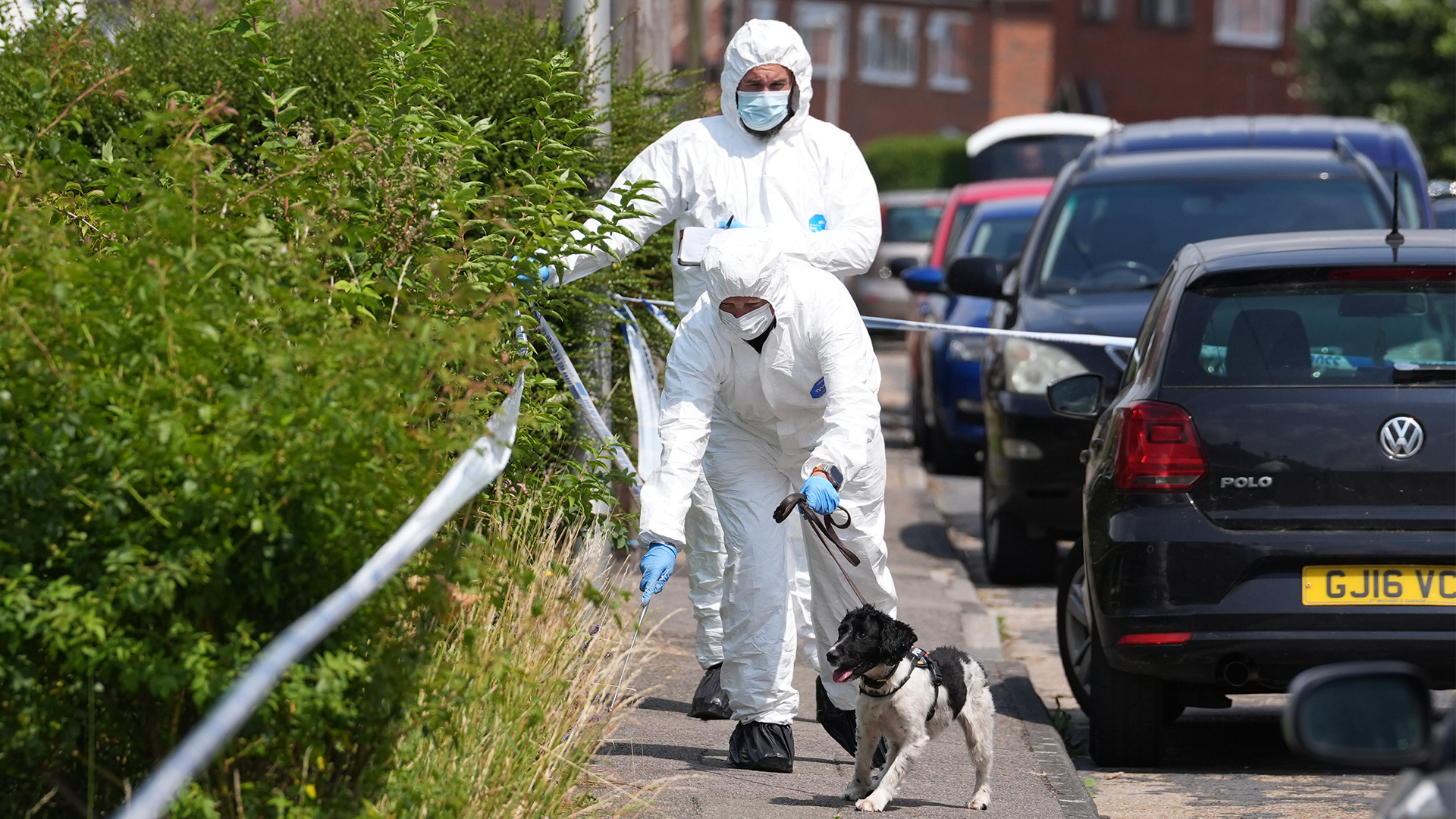 Forensic officers on Mooring Road in Rochester where a moped was stopped after the soldier was stabbed (Picture: PA)