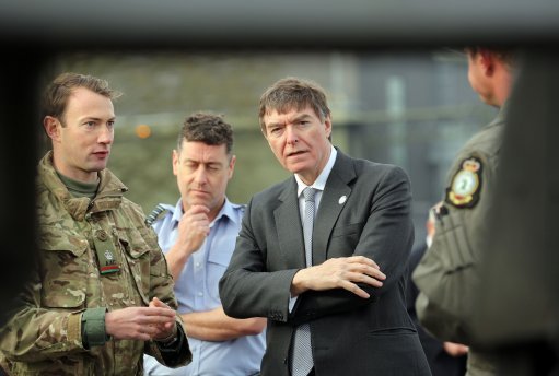 Former Defence Minister Philip Dunne with military personnel (Picture: PA).