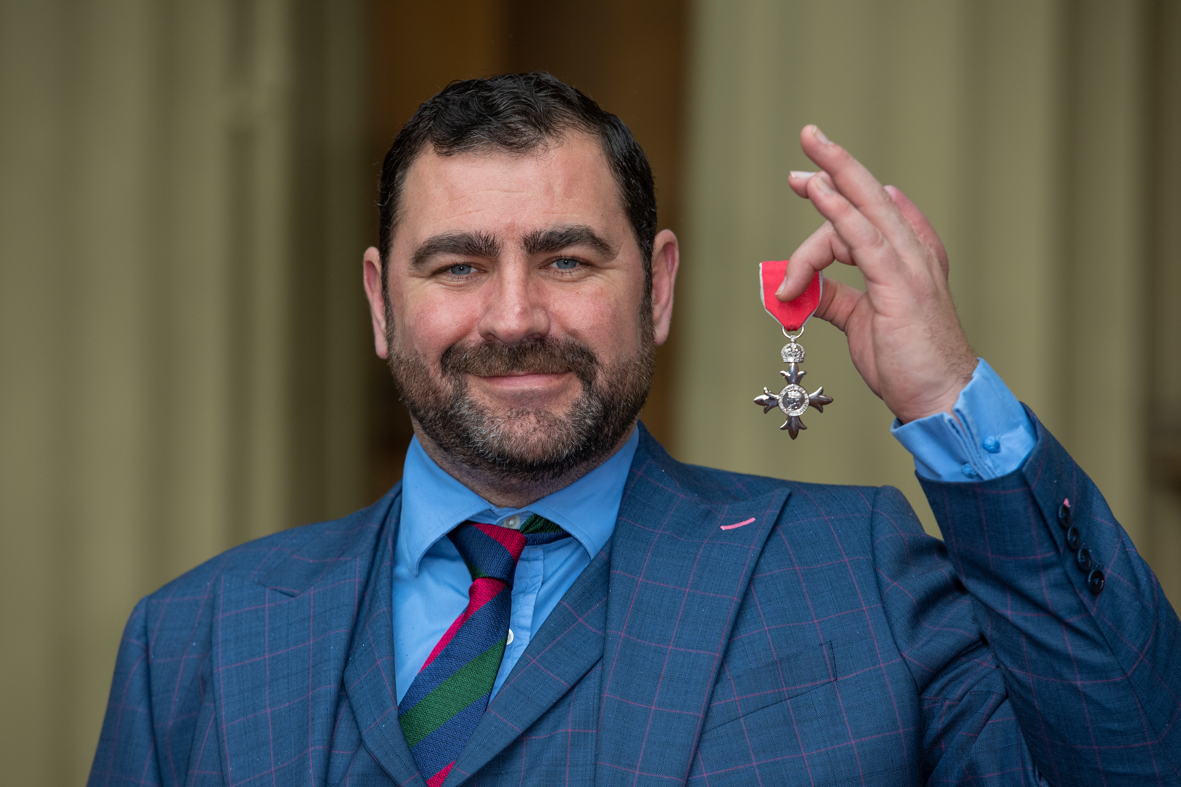 Cover image: Andy Reid received an MBE in November 2019 (Picture: PA).