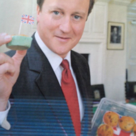 Former Prime Minister David Cameron holding one of Louise Bennet's buns of mass production CREDIT Louise Bennet