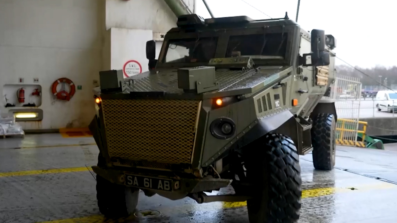 A Foxhound is loaded onto MV Anvil Point for Exercise Steadfast Defender (