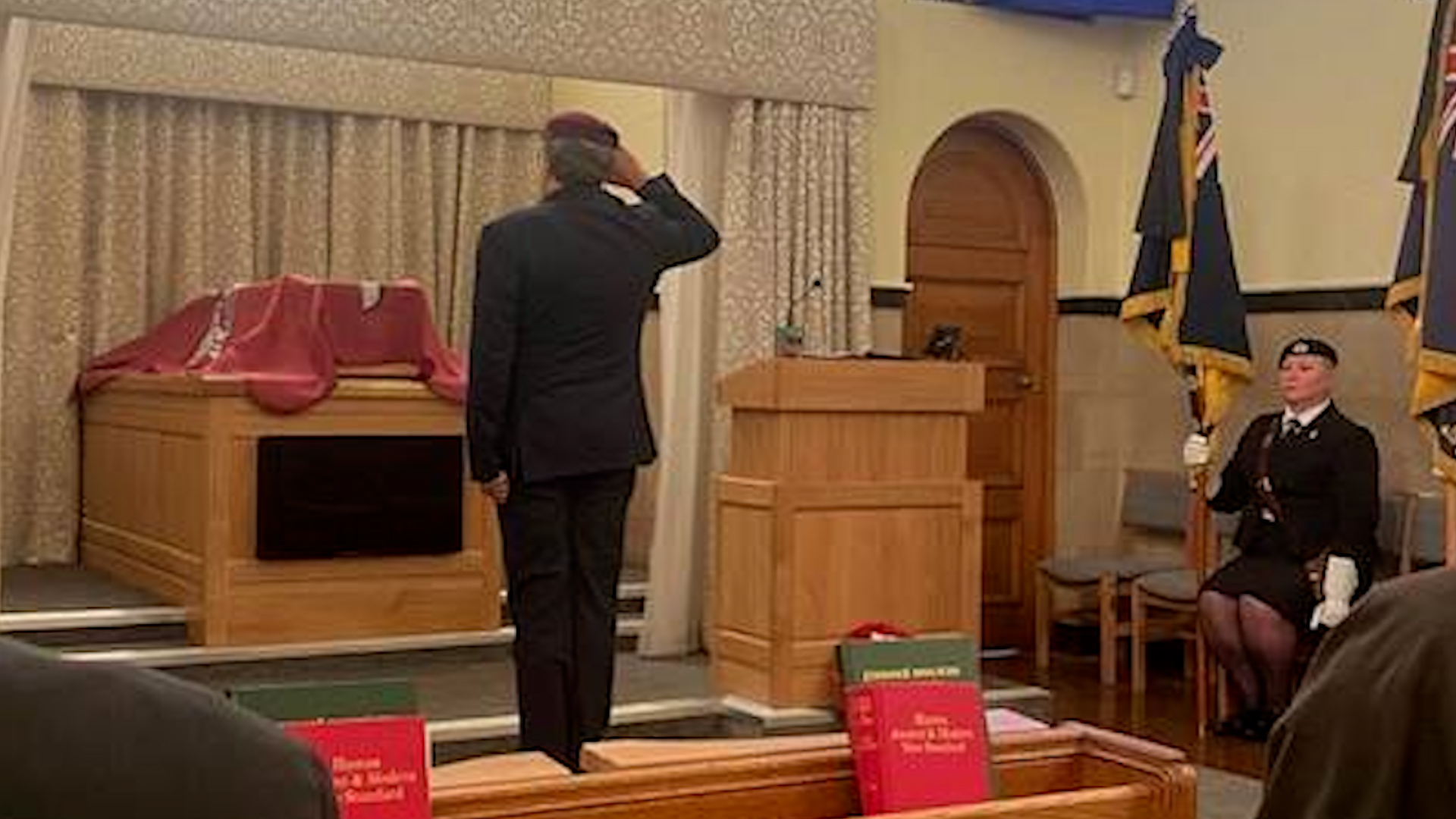 Funeral celebrant former Para and 22 SAS Bob Craft salutes the coffin of Lance Corporal Terence 'Paddy' Purcell