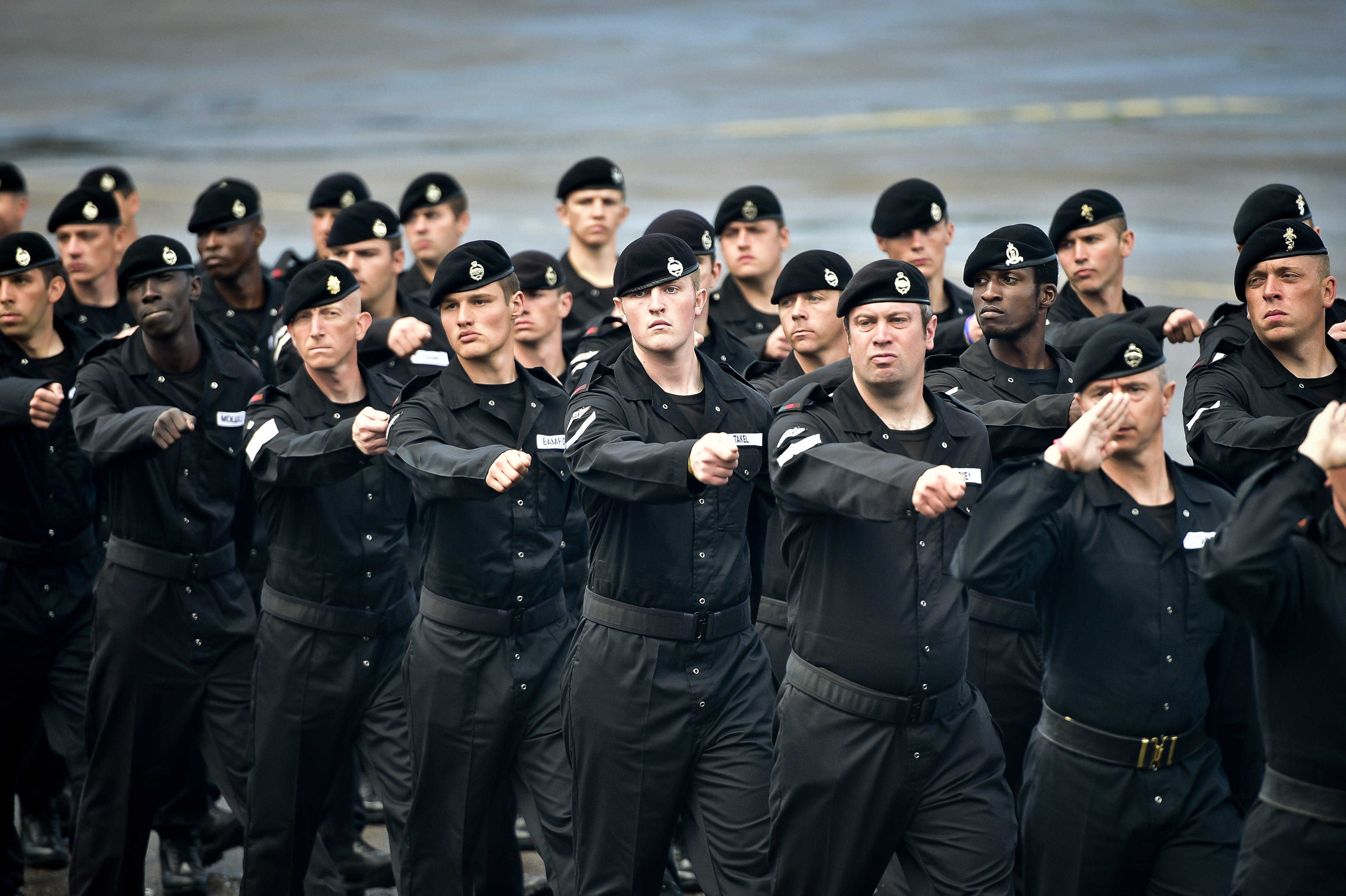 Image ID: G77NGC: Soldiers in the newly formed Royal Tank Regiment march off the parade square at Tidworth, Wiltshire, where both 1 & 2 Royal Tank Regiments are parading to mark their amalgamation into the Royal Tank Regiment. 