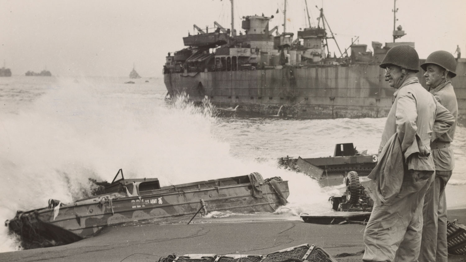 Gen Holland M Smith and Col Dudley S Brown look at the surf battered wreckage at the Battle of Iwo Jima CREDIT National Archives and Records Administration