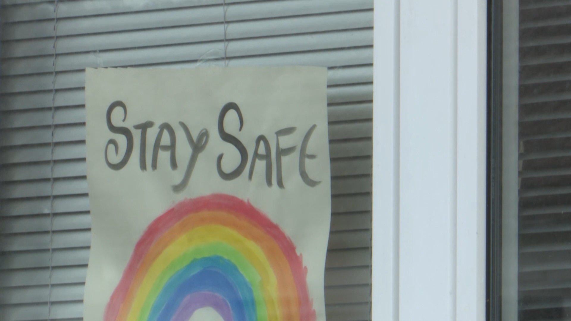 A 'stay safe' drawing on a window of a house in Germany.