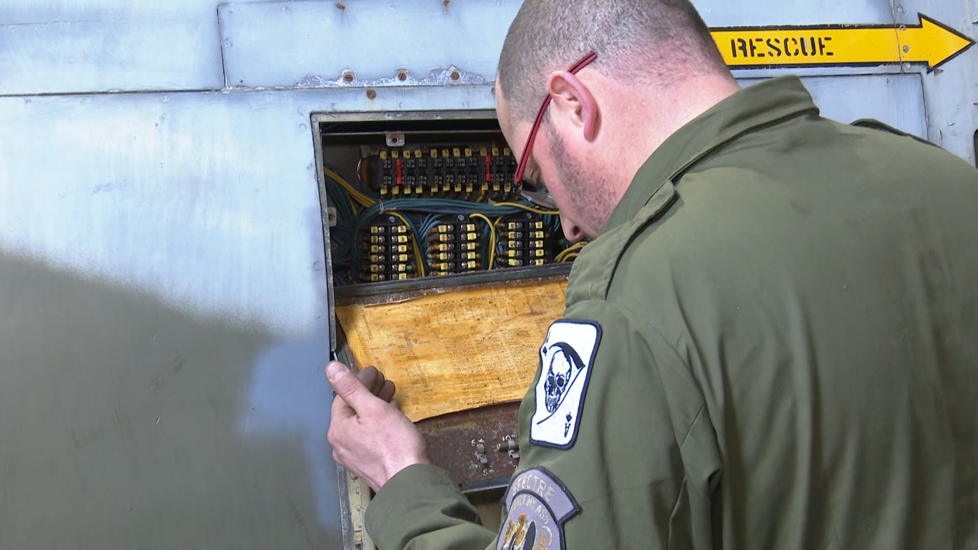 Mr Buckle inspecting the aircraft's electrics.