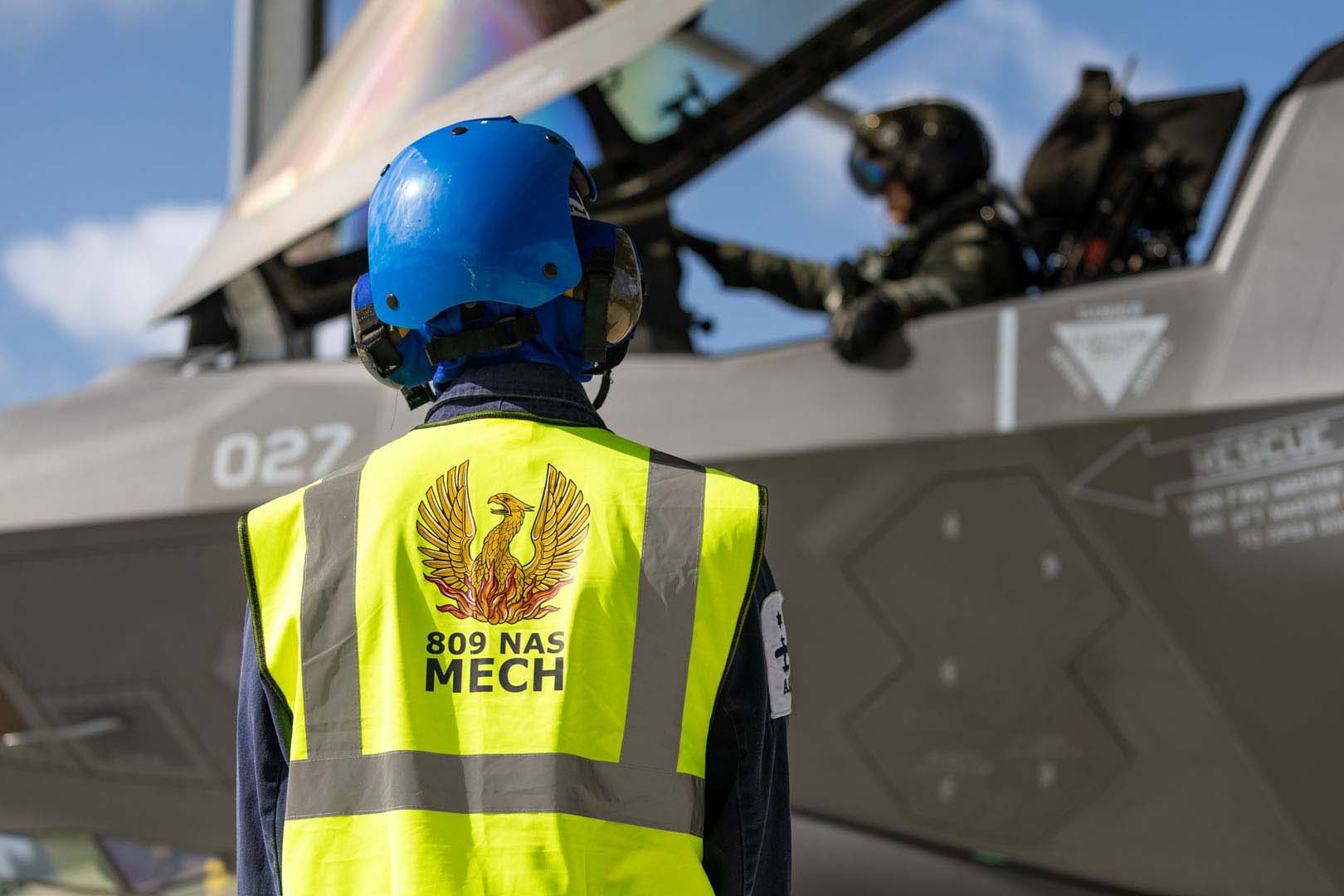 Ground crew directing a F-35B Lightning jet being operated by 809 Squadron in the first sortie operated by the Navy squadron 150724 CREDIT Royal Navy