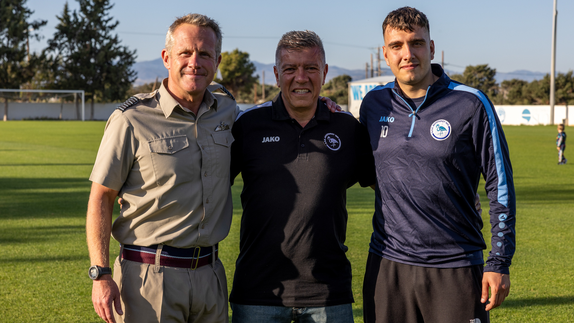 Group Captain Simon Cloke, Andy Georgiou, Nikolas Georgiou RAF Akrotiri Apea FC Credit BFBS DATE 15042025.jpg 
