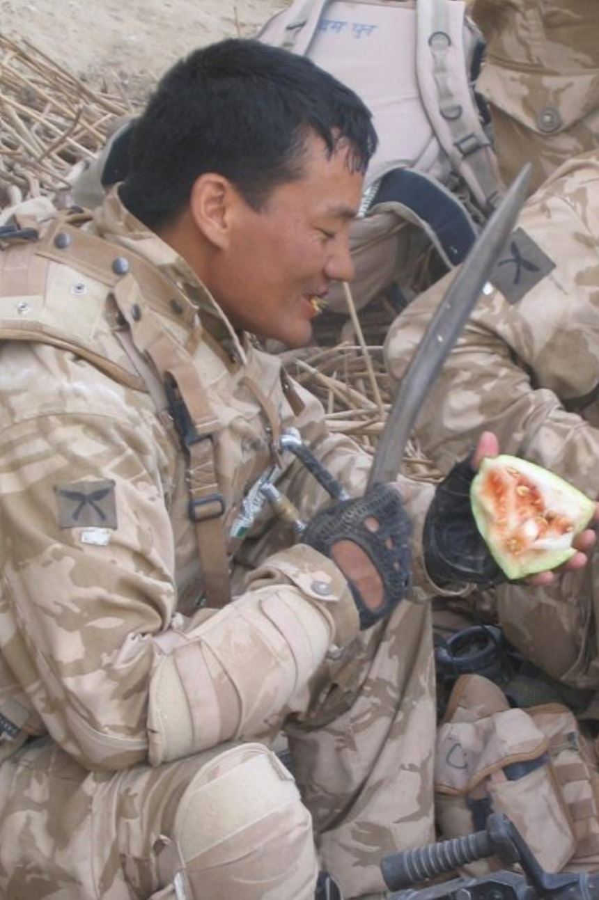 Gurkha soldier in Afghanistan eating watermelon with Kukri Picture: MoD 