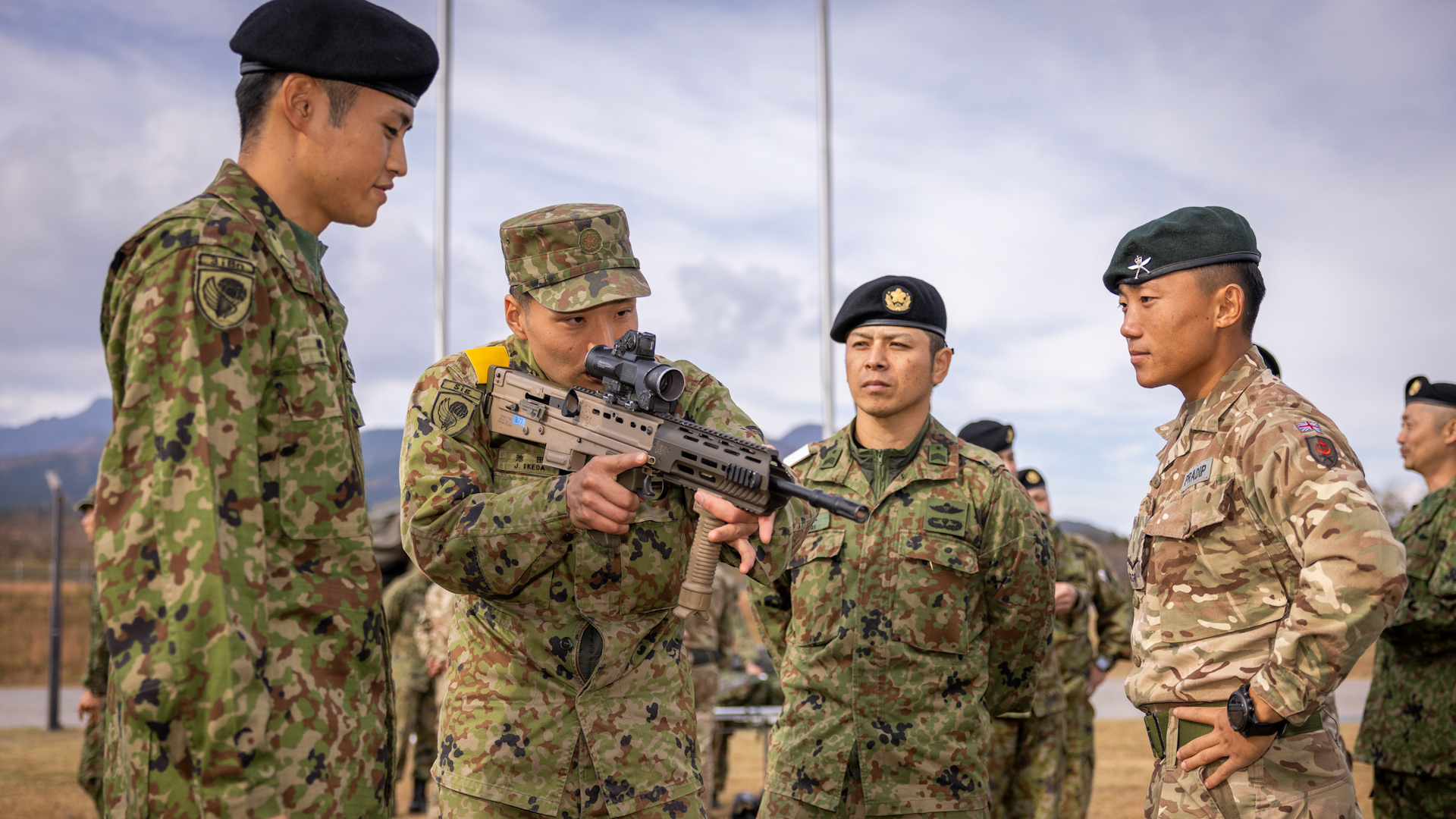 Gurkha from the 1st Battalion, The Royal Gurkha Rifles, shows Japanese soldiers the British SA80 A3 rifle during Exercise Vigilant Isles in Japan (Picture: British Army).