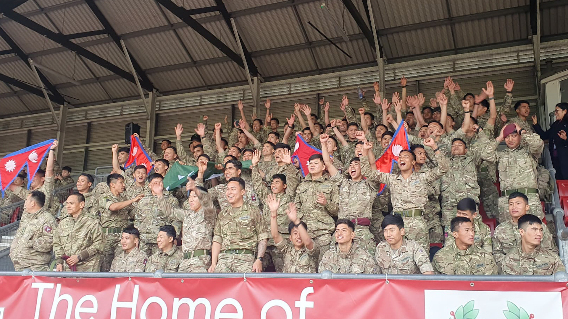 Gurkhas watch the Nepal national team play in Aldershot