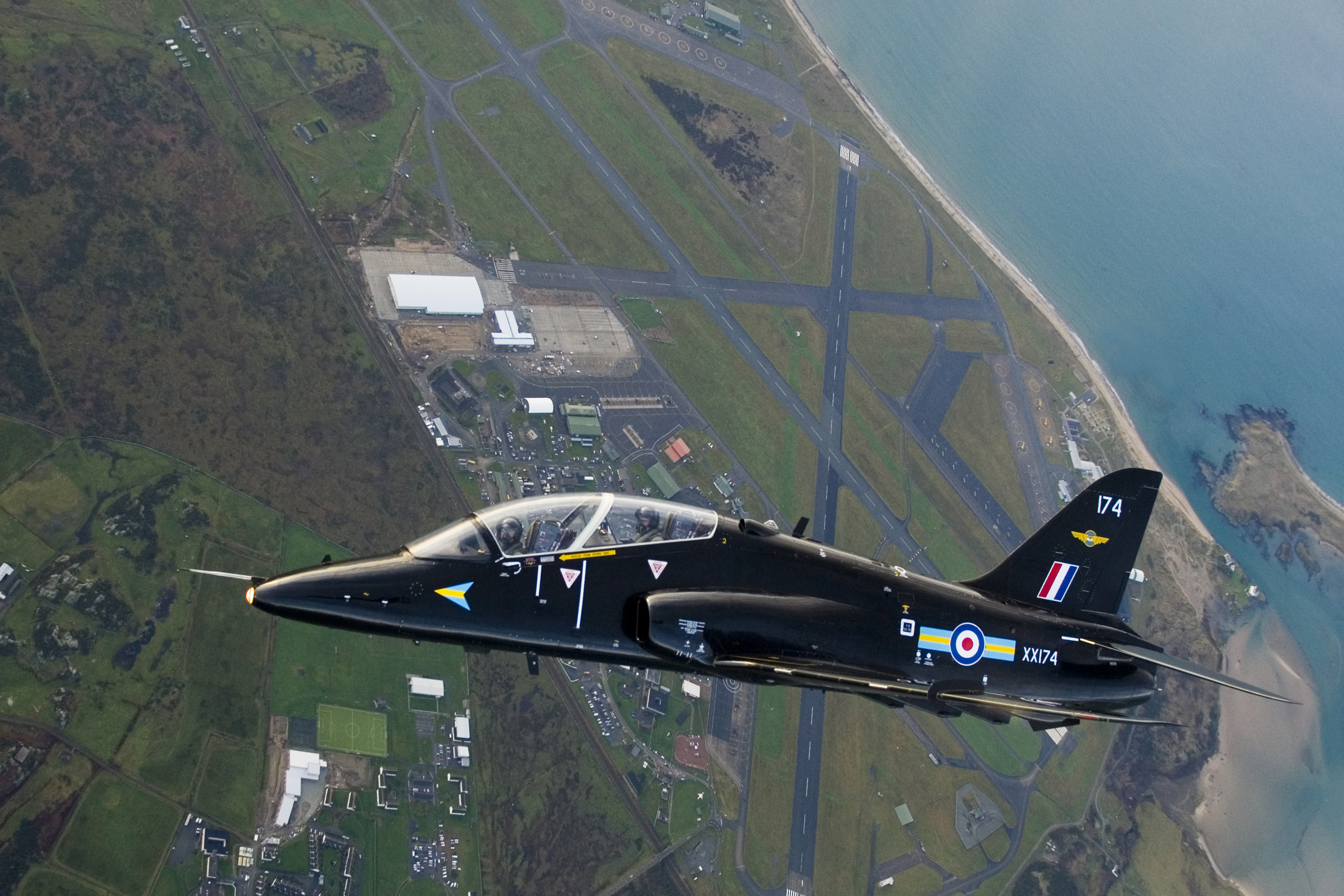 A Royal Air Force Hawk T1 jet aircraft flies high above it's base at RAF Valley in Anglesey, Wales (Picture: Cpl Paul Oldfield / Crown Copyright).