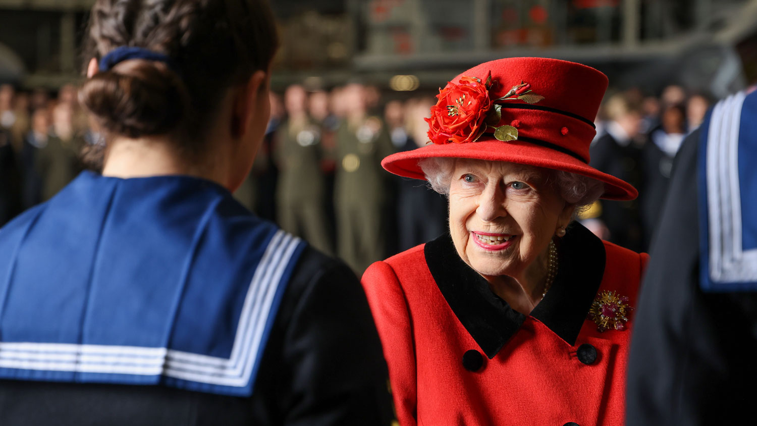 HM Queen Elizabeth II meets with members of the ships company Royal Navy aircraft carrier HMS Queen Elizabeth in Portsmouth 22 May 2021 CREDIT Crown Copyright