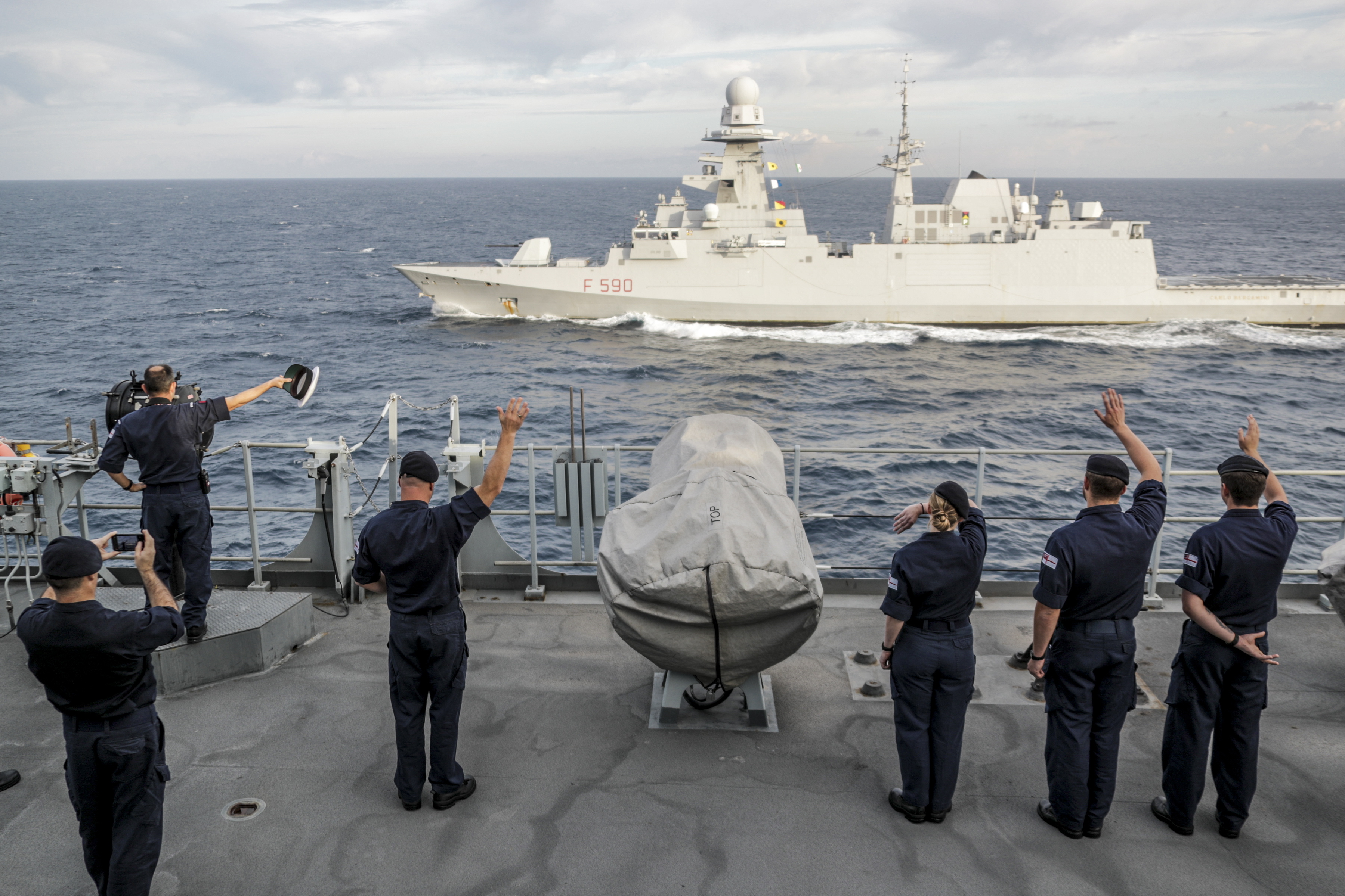 Cover image: HMS Albion sailors wave to Italian frigate Carlo Bergamini after training in the central Mediterranean (Picture: Royal Navy).