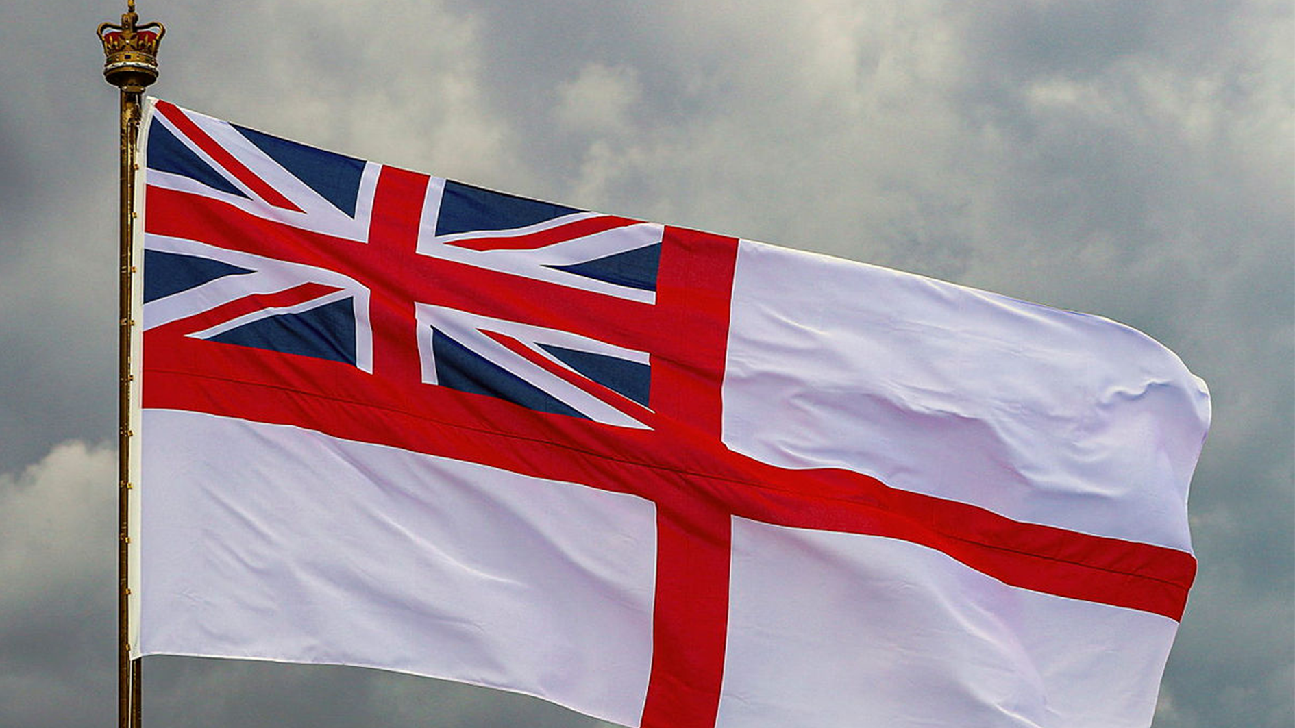 HMS Albion's white ensign flies as she arrives in Kiel, Germany 210623 CREDIT MOD