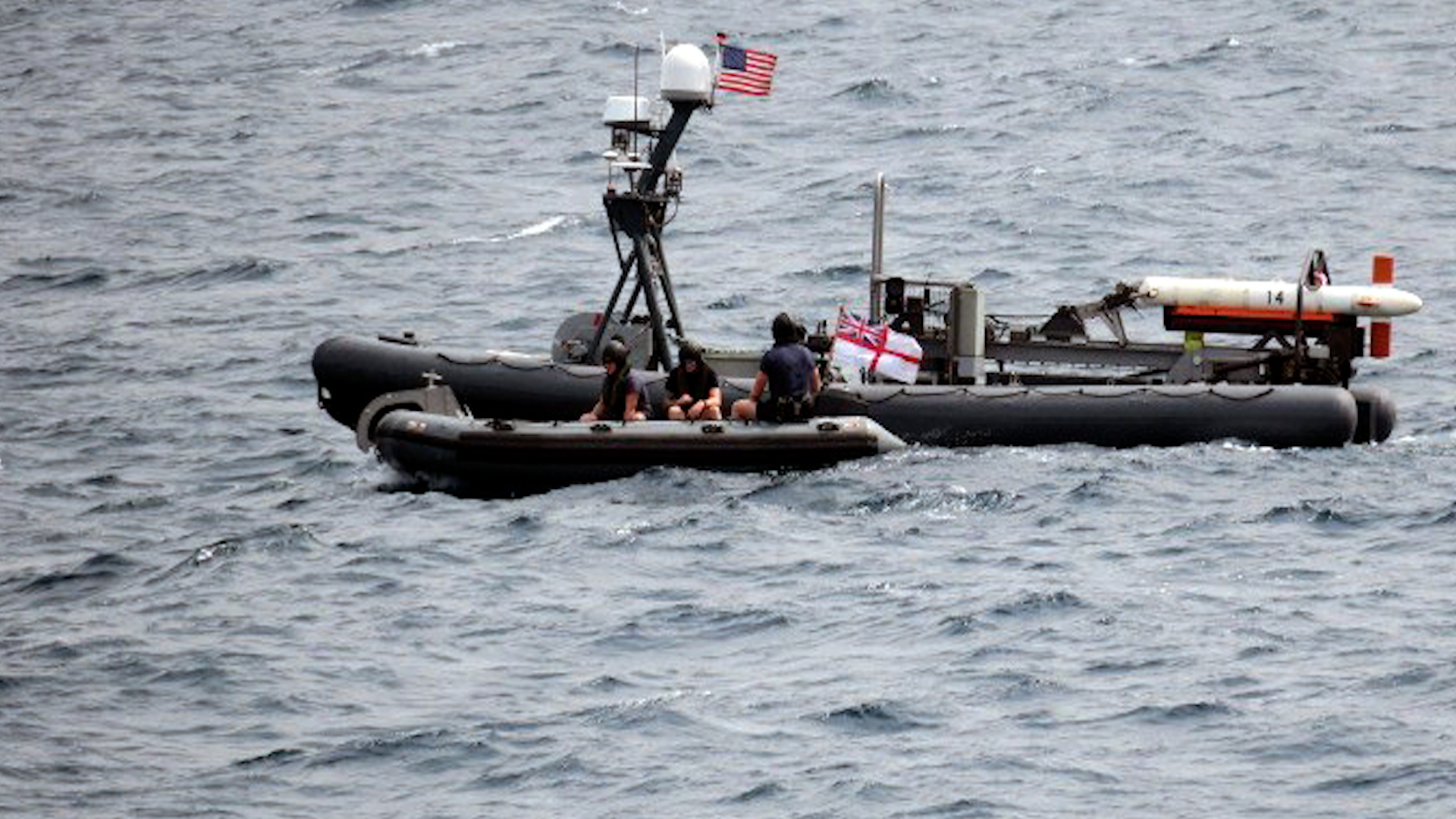 HMS Bangor's sea boat meets up with the US robot boat (Picture: Royal Navy).