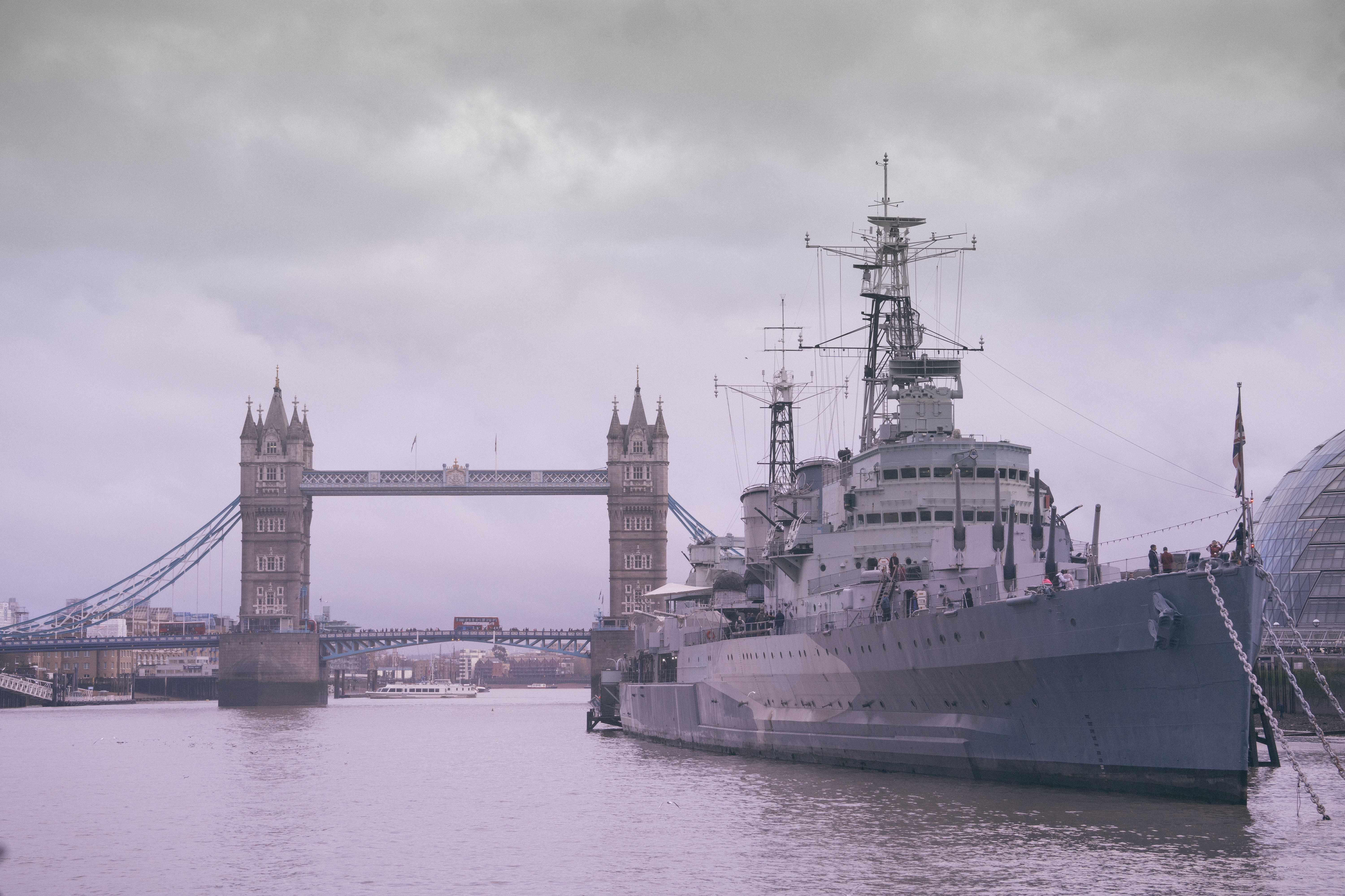 HMS Belfast moored by Tower Bridge on the River Thames in London