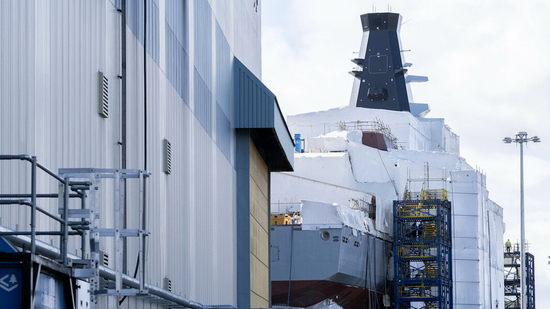 HMS Cardiff towers over the BAE Systems Govan shipyard