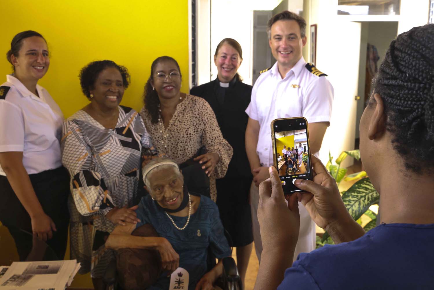 HMS Dauntless' ship's company meets Second World War veteran Ena Collymore-Woodstock and her family in Barbados CREDIT Royal Navy