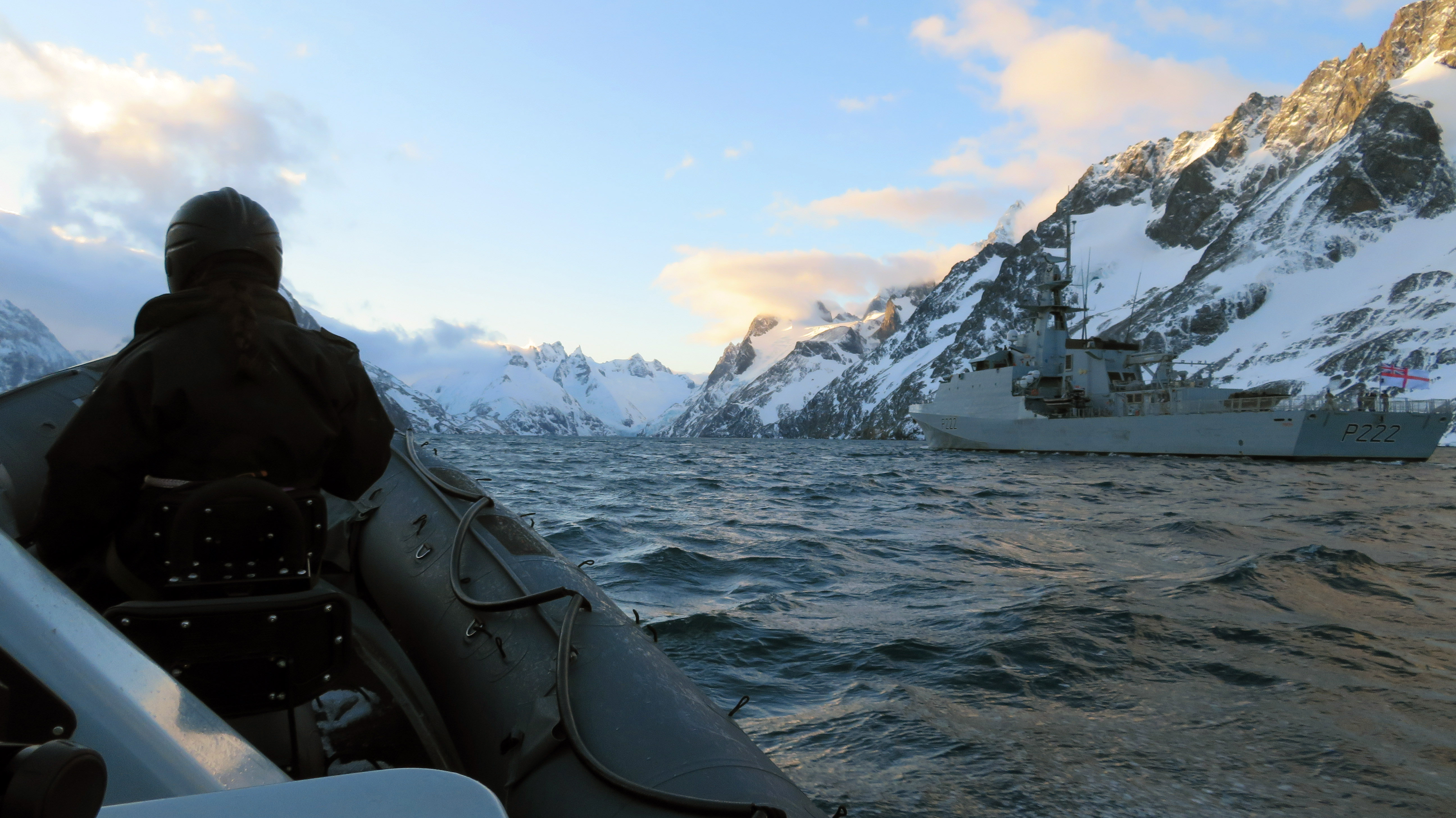 HMS Forth's sea boat returns to the mother ship in a snow-covered fjord (Picture: Royal Navy).