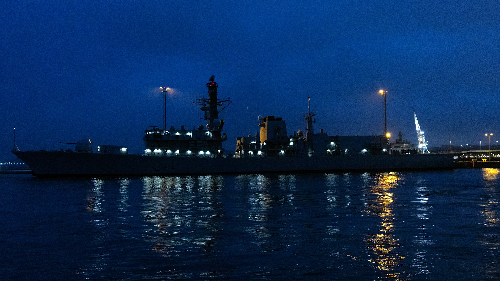 HMS Iron Duke lit up at night in Tallinn Naval Base CREDIT Estonian Armed Forces