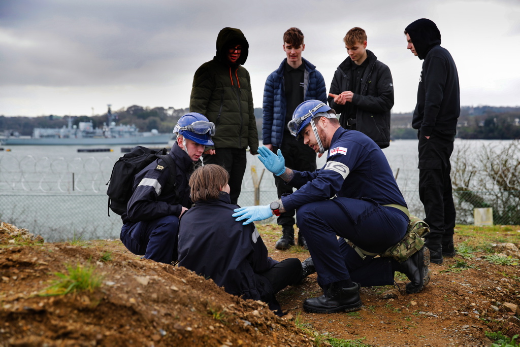 HMS Kent sailors with civilians at disaster relief exercise