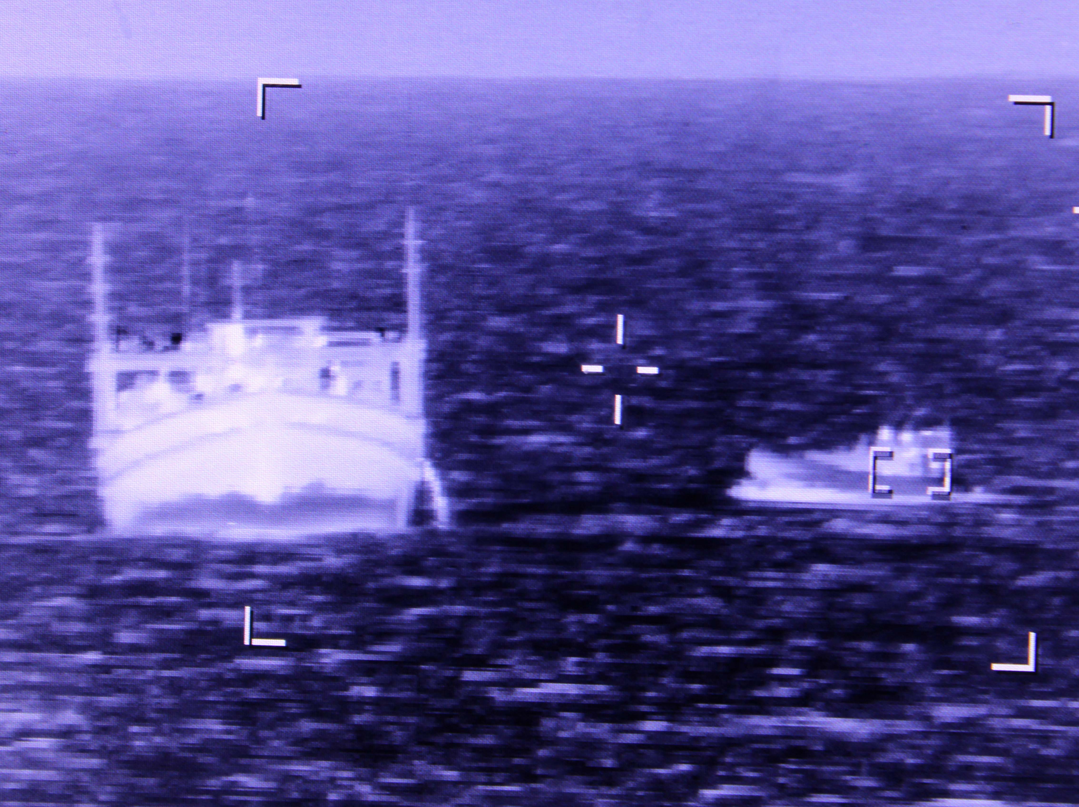 HMS Lancaster's boarding team approach suspicious vessel in the Arabian Sea before seizing drugs