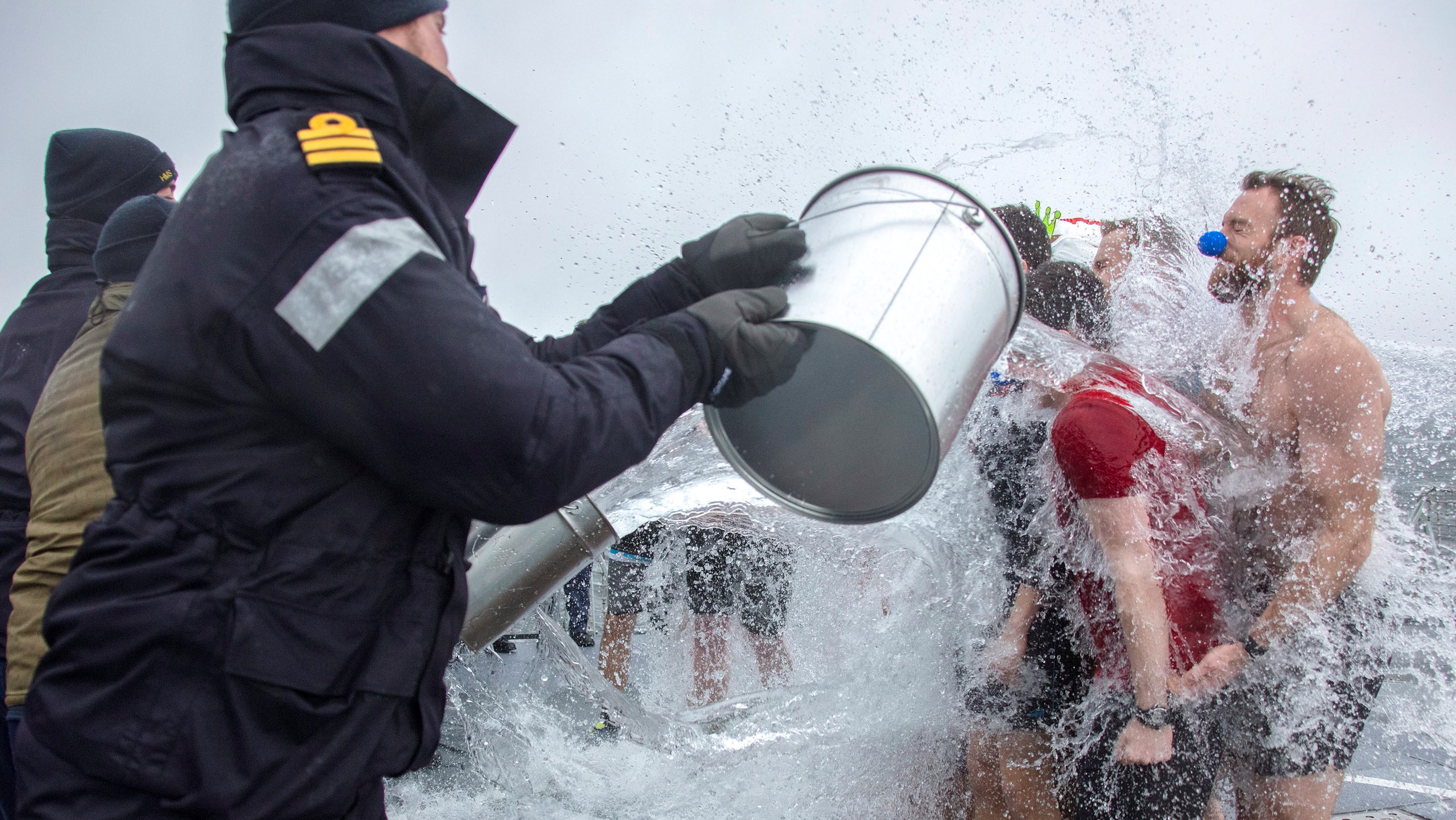 HMS Lancasters crew receive ice bath during crossing the line ceremony held in the Norwegian Fjords 21032021 CREDIT John French MOD .jpg
