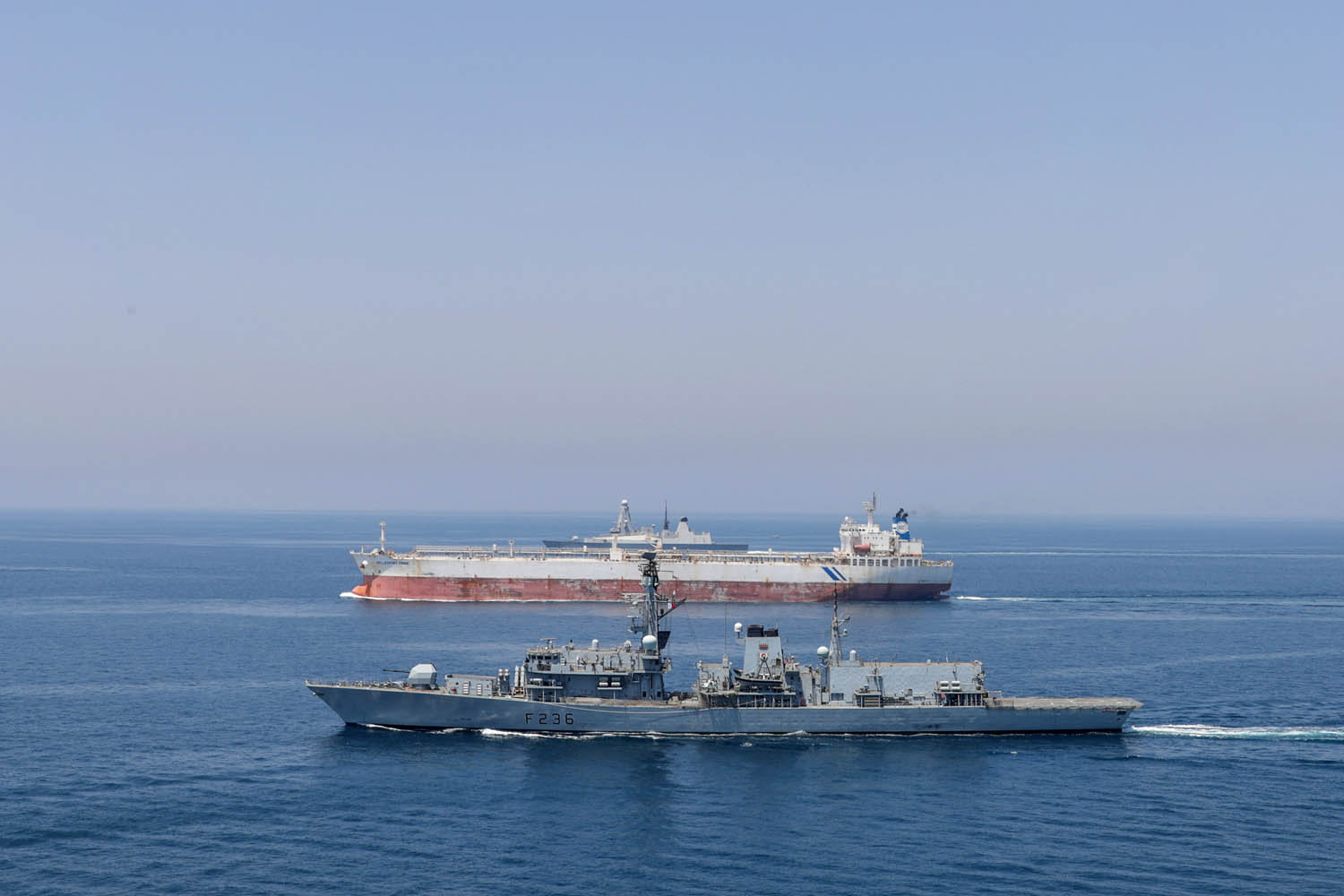 HMS Montrose is one of the Royal Navy ships to have contributed to the security mission - seen here escorting tanker Hellepont Pride (Picture: Royal Navy).