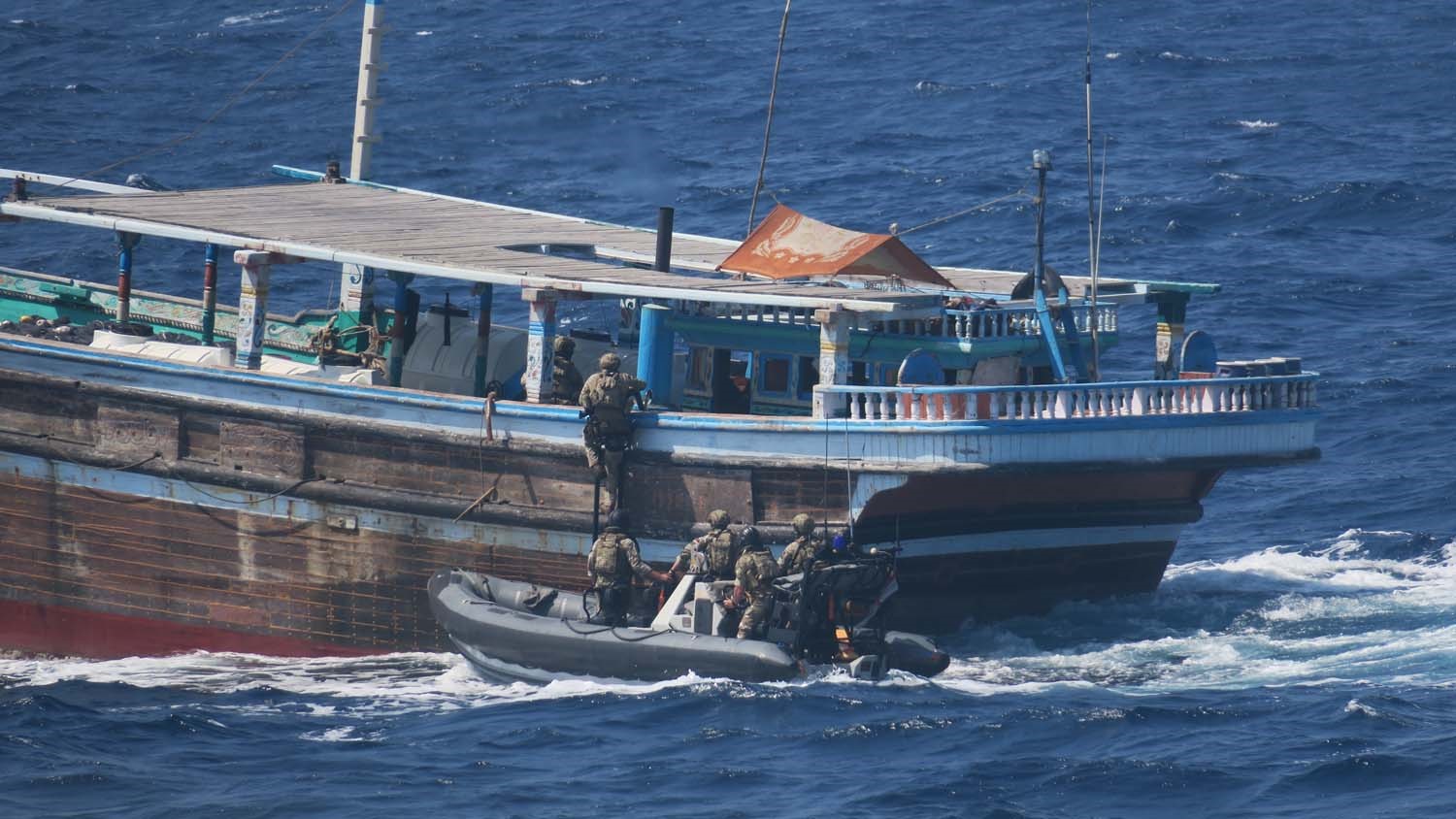 HMS Montroses Royal Marines boarding team climbing aboard a dhow 18072022 CREDIT Royal Navy.jpg