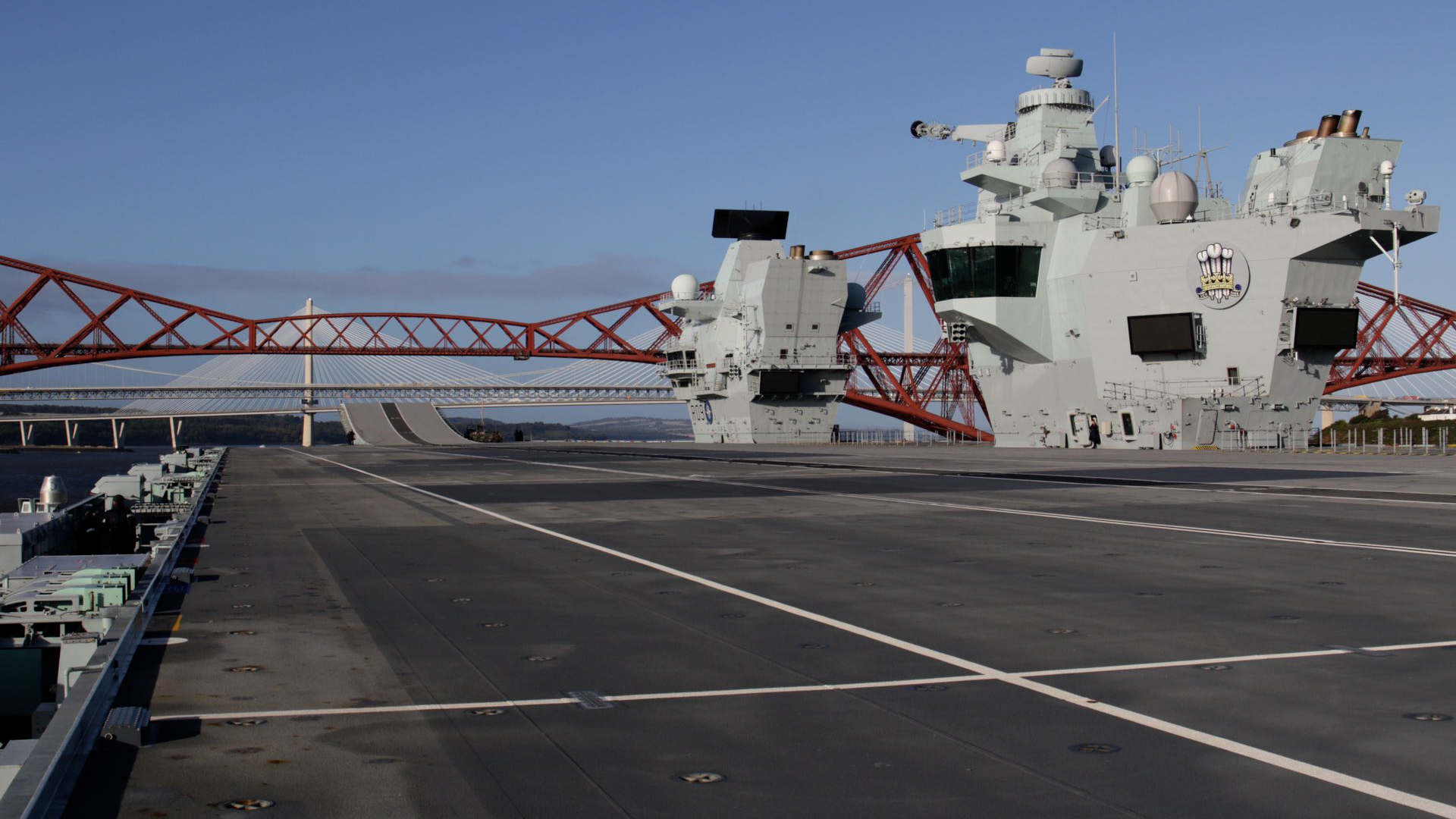 HMS Prince of Wales goes under the Forth bridges on its way to Rosyth
