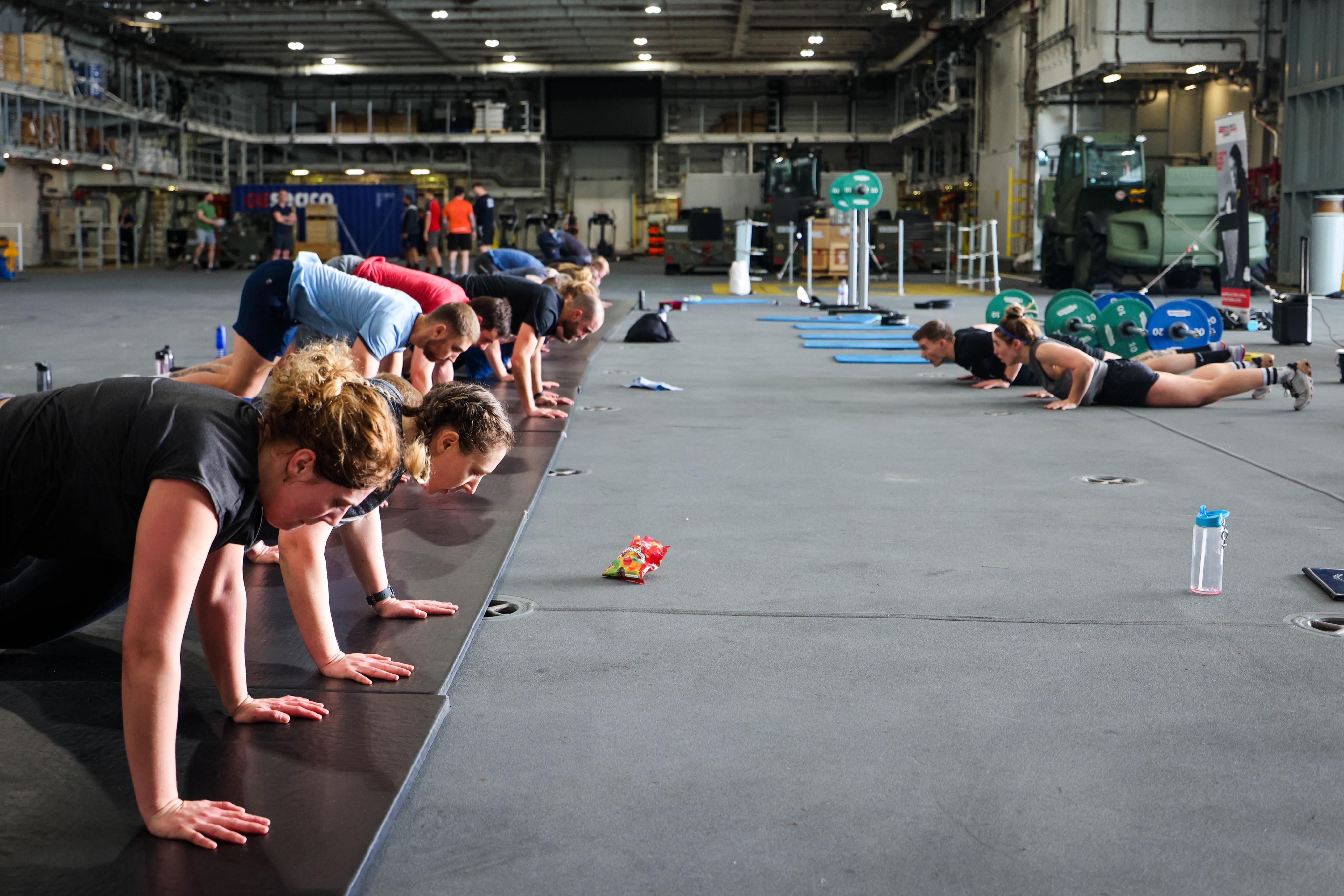 HMS Prince of Wales personnel complete burpees in a charity challenege CREDIT HMS Prince of Wales Twitter