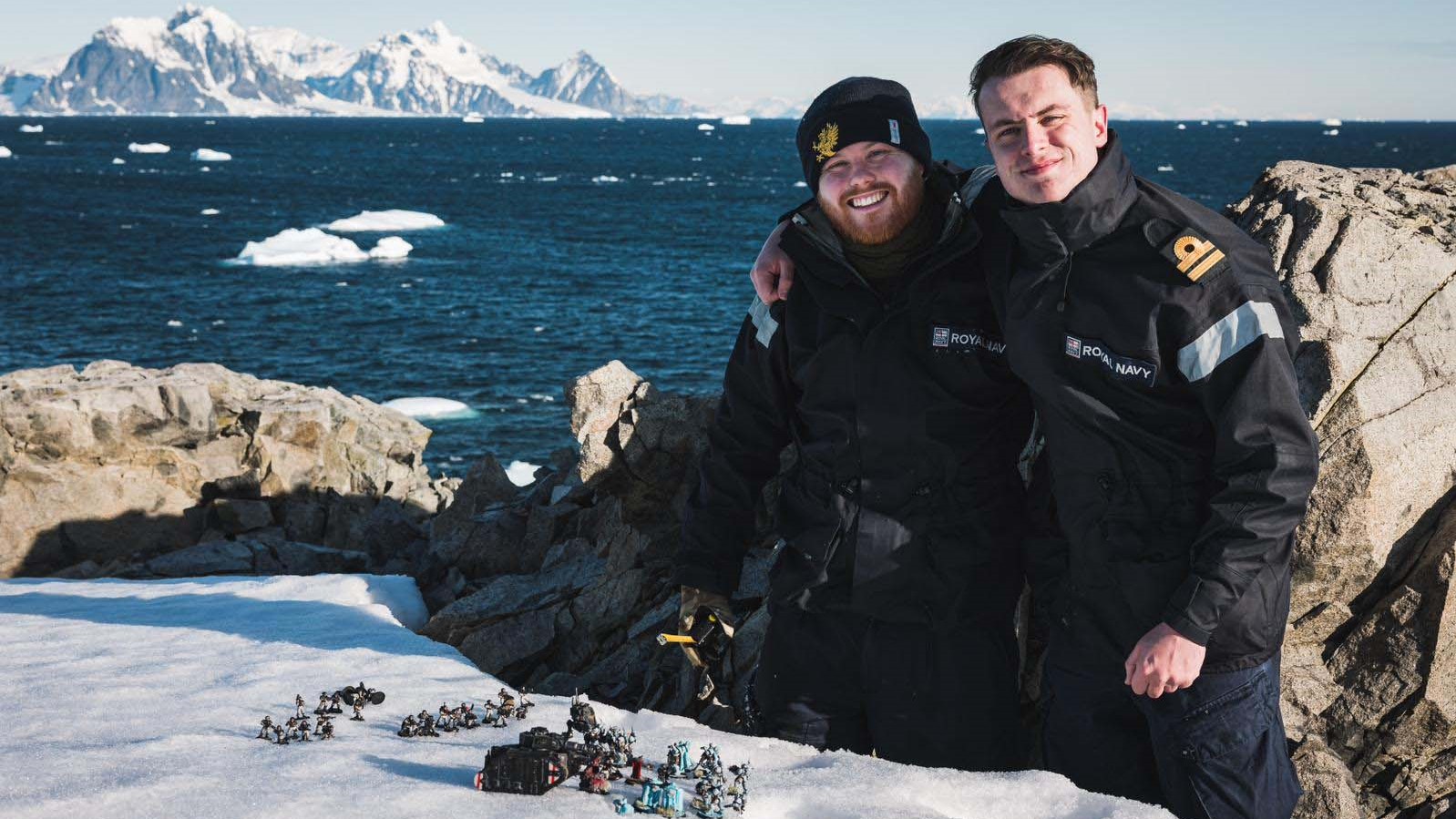 HMS Protector sailors Lts Jonny Talbor and Max Friswell with Warhammer pieces in the snow11022023 CREDIT 