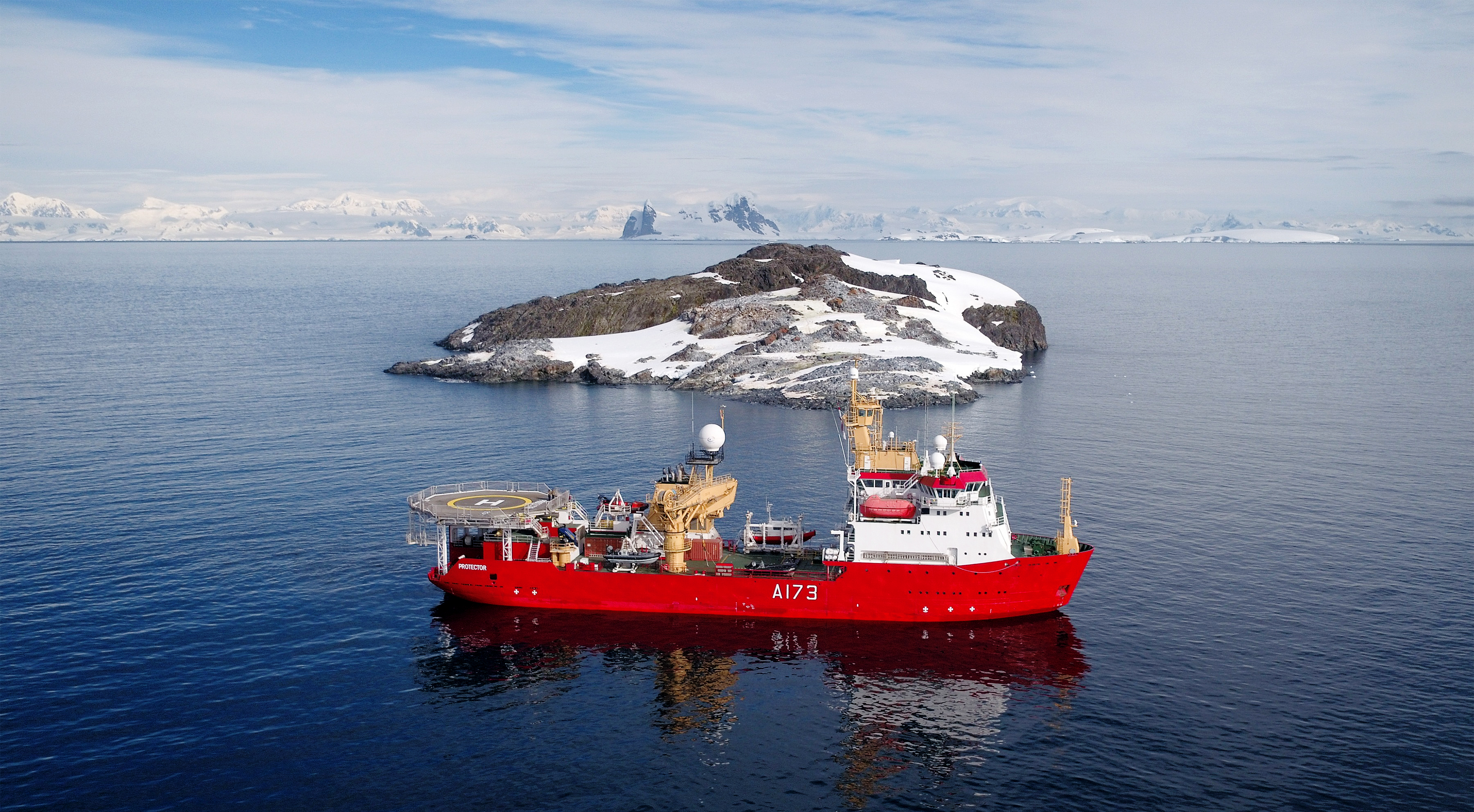 HMS Protector sails close to Fizkin Island, part of the Pitt Islands, in the Antarctic