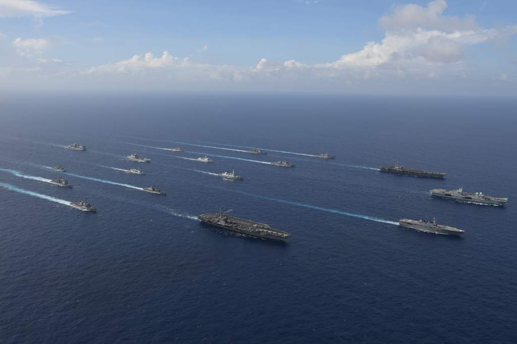 HMS Queen Elizabeth alongside aircraft carriers from both Japan and the US during a joint exercise whilst on the CSG21 deployment