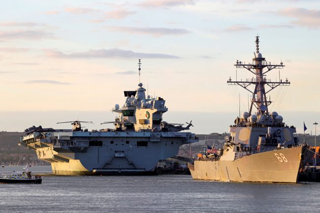 HMS Queen Elizabeth and USS The Sullivans alongside HMNB Portsmouth prior to sailing on Carrier Strike Group 21
