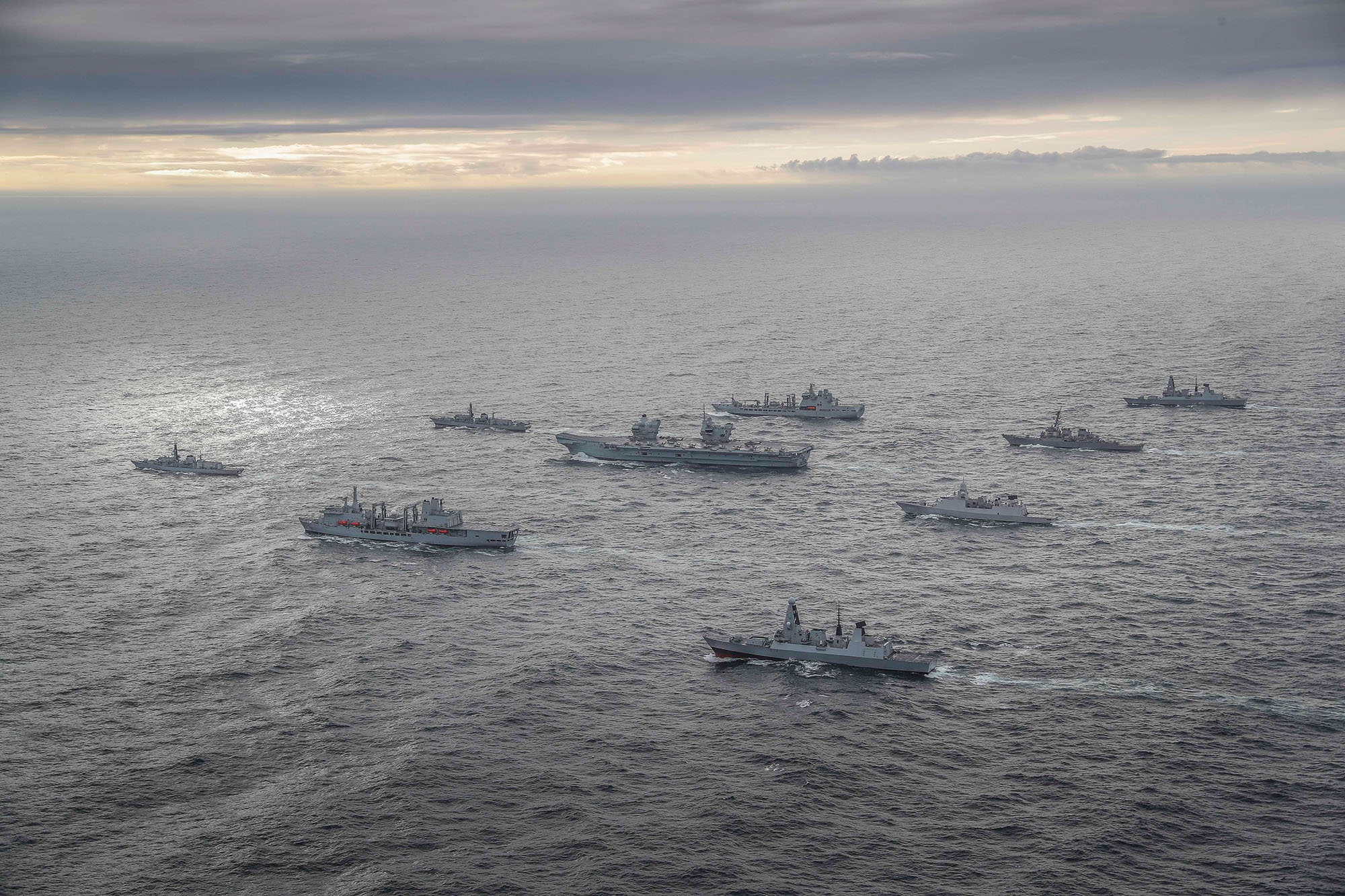 HMS Queen Elizabeth during Exercise Joint Warrior surrounded by other vessels as Carrier Strike Group forms