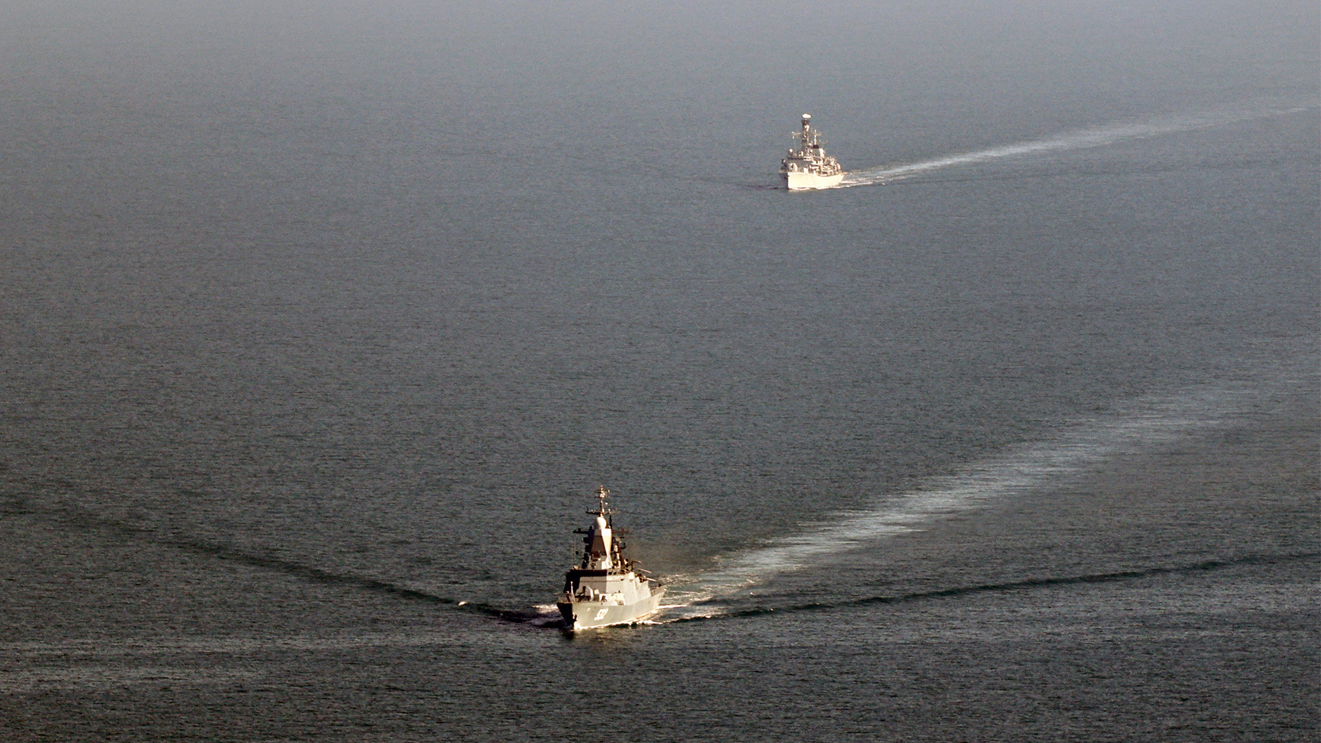 HMS Somerset follows close behind a Russian warship Biokiy in the English Channel