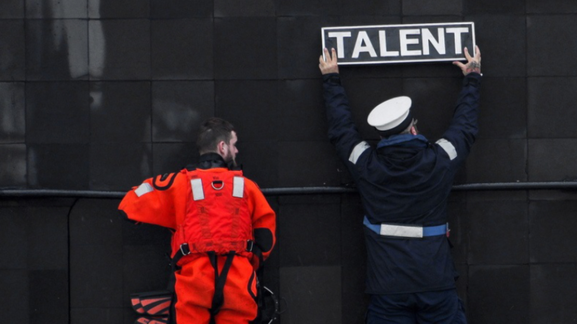 Placing the name sign (Picture: MOD).