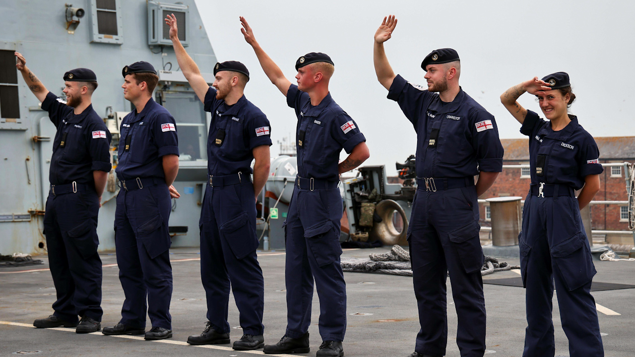 HMS Duncan's crew waving goodbye to their families at Portsmouth Naval Base (Picture: Royal Navy).
