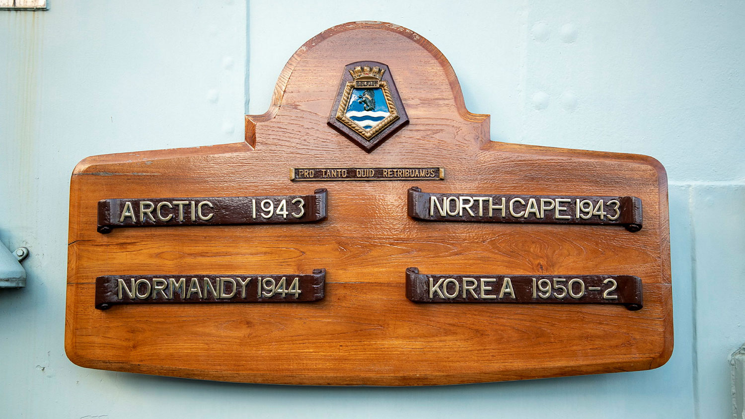 HMS Belfast's battle honours board on the ship's quarterdeck to mark the naval losses suffered during the WW2 Arctic Convoys CREDIT Crown Copyright