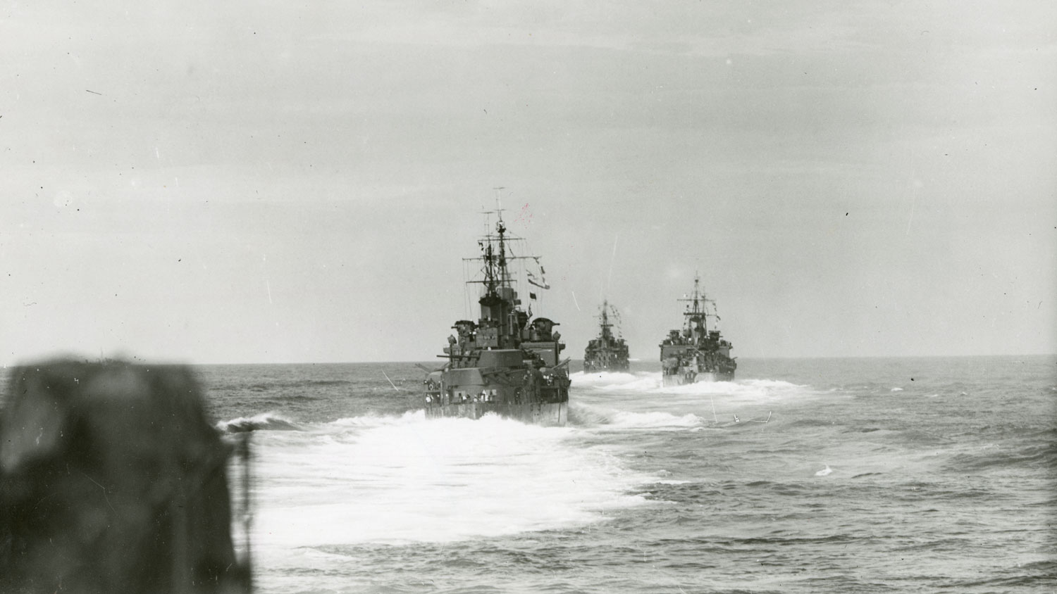 HMS Edinburgh pictured in 1938 underway at sea at speed as part of force H accompanying a convoy during early part of WW2. Ahead are HMS Sheffield and HMS Kenya CREDIT The National Museum of the Royal Navy