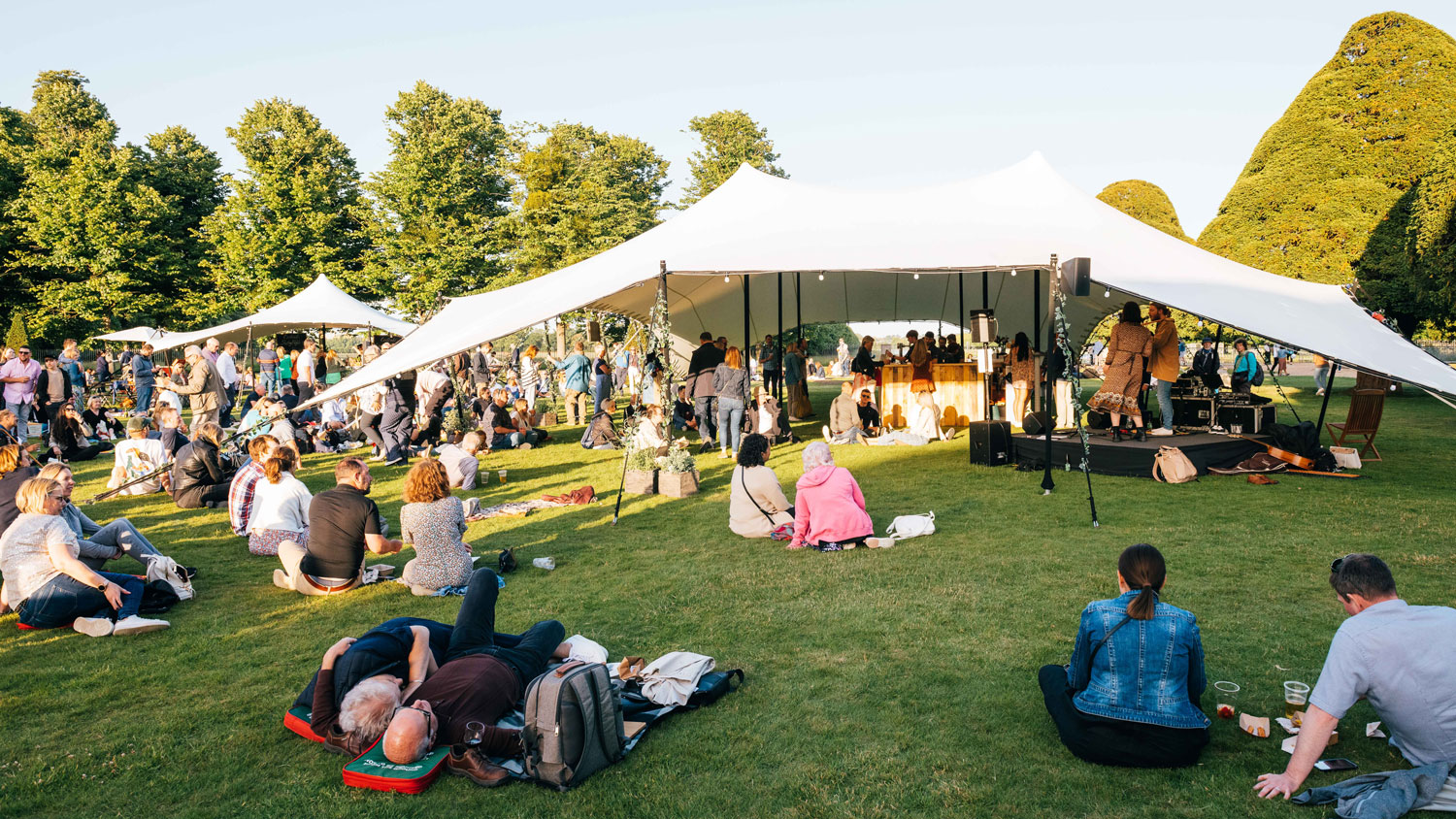 People enjoying a festival at Hampton Court Palace CREDIT Joshua Atkins