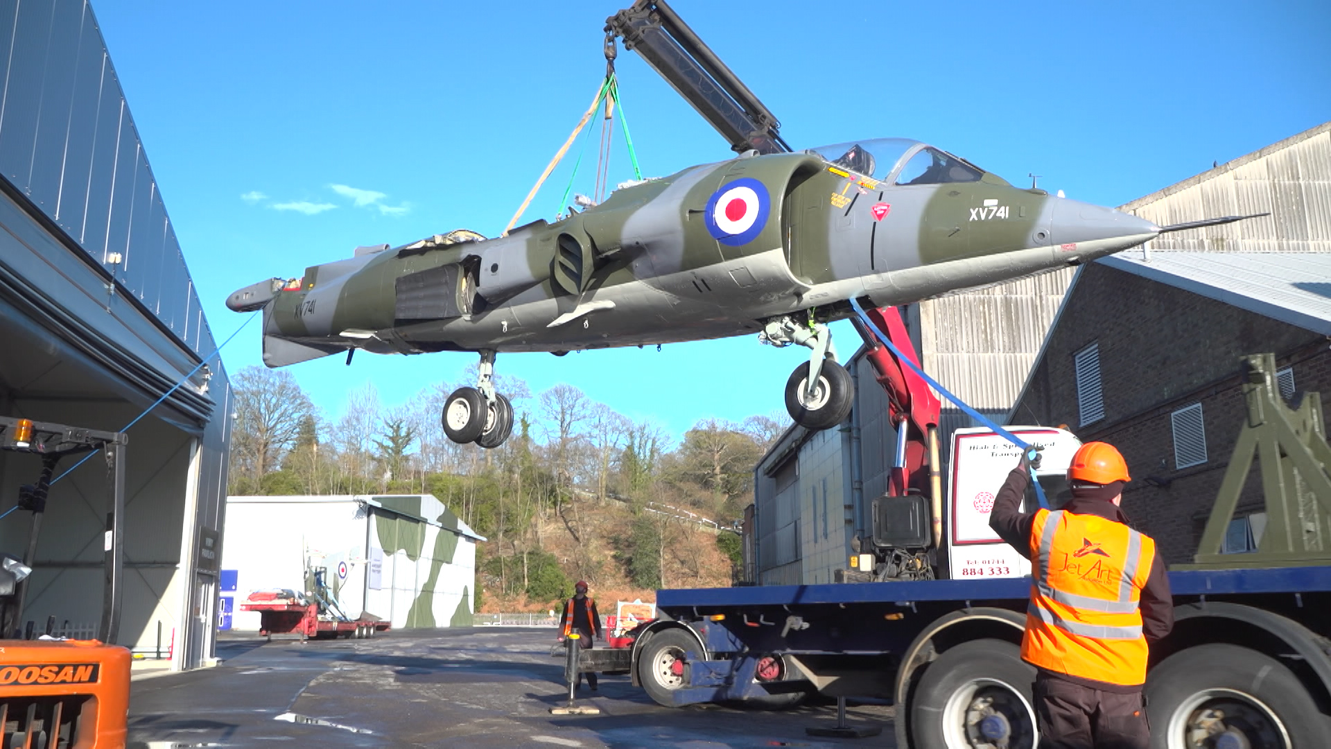 Harrier being lifted off the lorry at the museum.