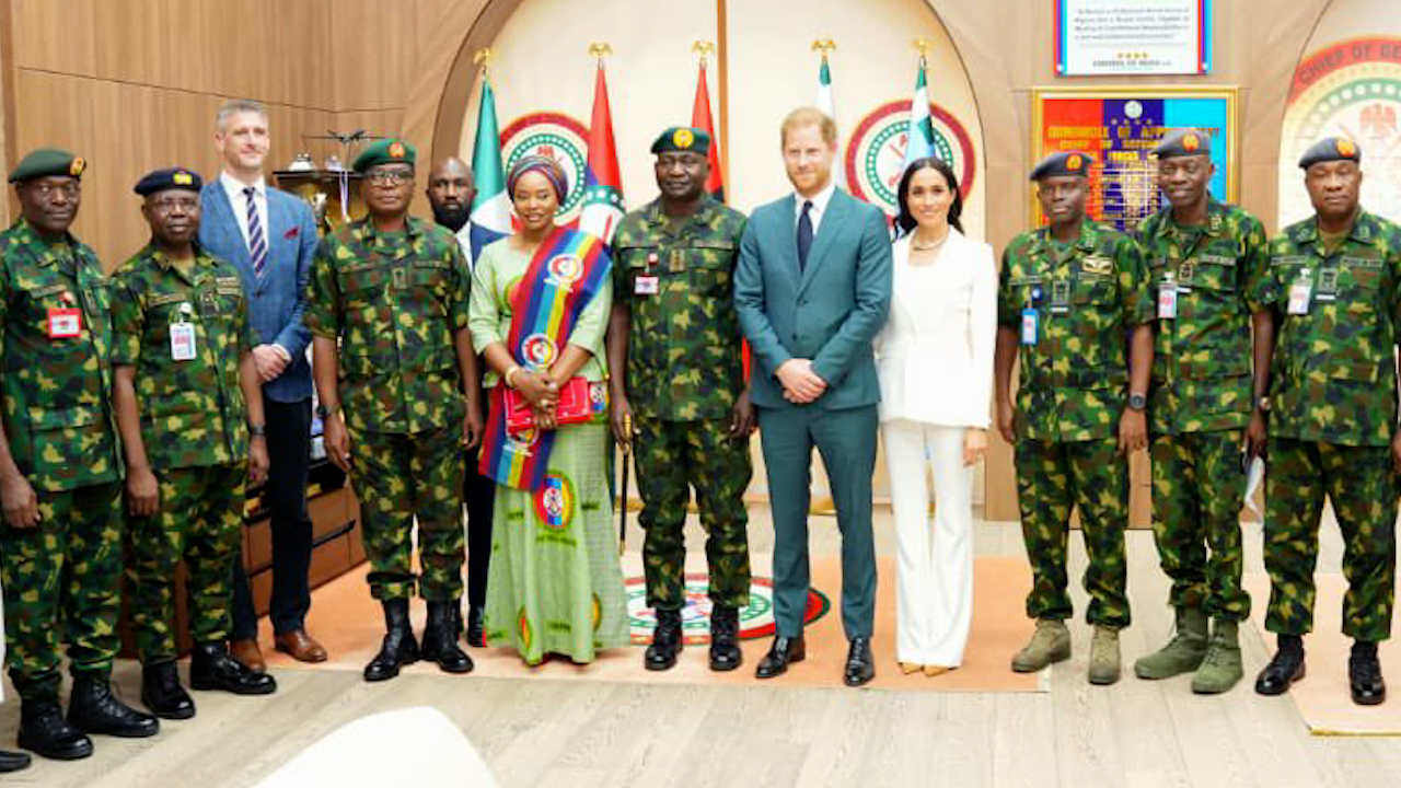 Prince Harry and Meghan Markle pictured with military officials in Nigeria (Picture: Defence HQ Nigeria).