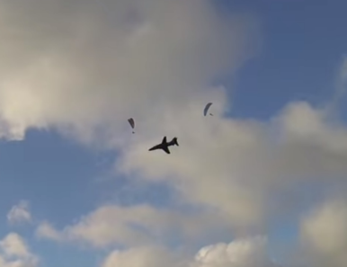 Hawk T1 flies close to paragliders