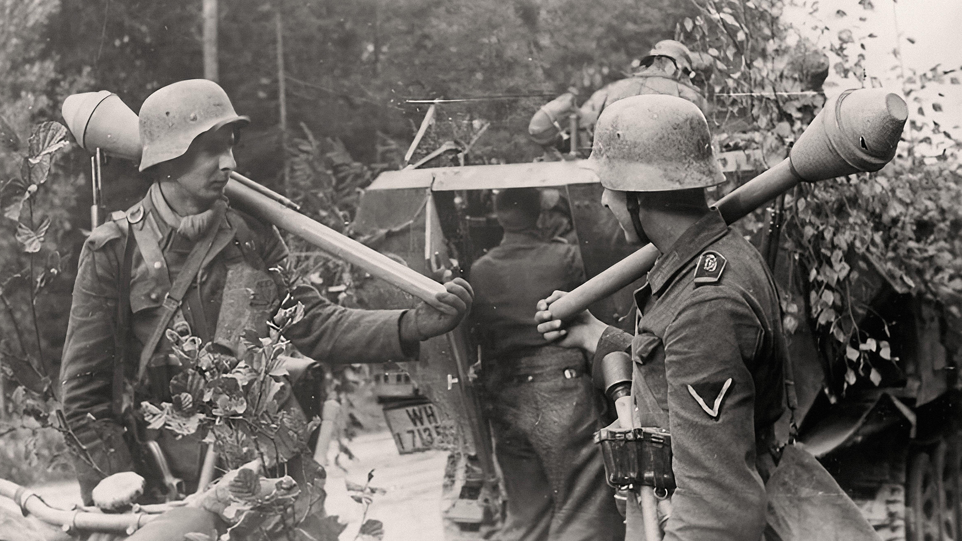 The Panzerfaust 30 these men are carrying was a disposable launcher that fired a shaped charge