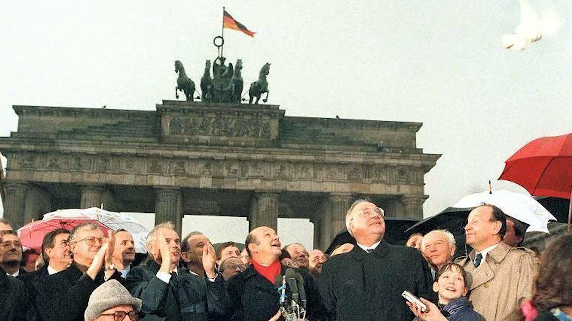 East German leader Hans Modrow (second from left) and German Chancellor Helmut Kohl (glasses, second from right) at the opening of the Brandenburg Gate (picture: Barry Davies).