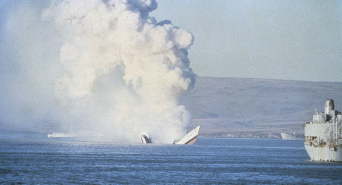 Her back broken, HMS Antelope still smoulders as she sinks in San Carlos Bay during the Falklands War 24 May 1982 CREDIT ROYAL NAVY.jpg