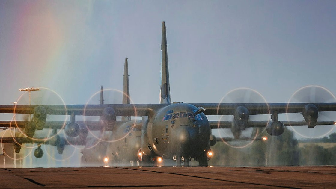 Hercules C-130J from 47 Sqn at RAF Brize Norton, taxing through spray (creating an artificial rainbow) after returning from a final flypast over the UK 14062023 CREDIT MOD.jpg